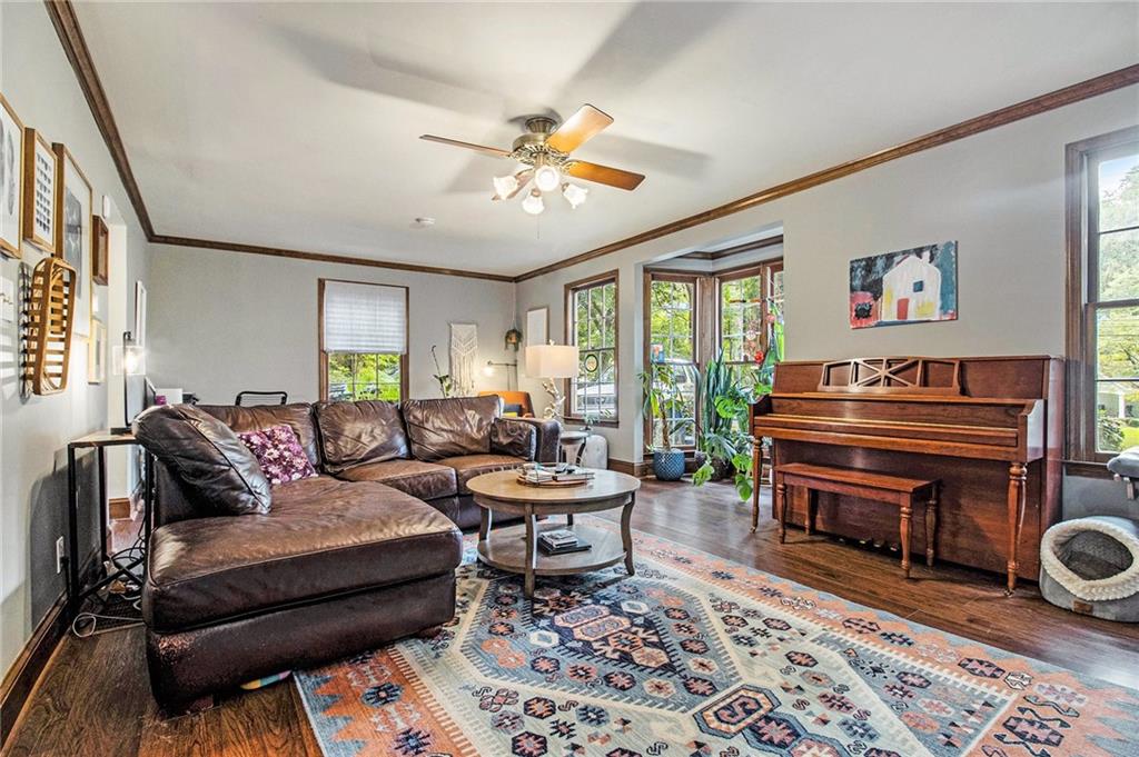 1639 Frazier Road Decatur, GA 30033 - Photo 7 of 30 a living room with furniture a piano and a bookshelf