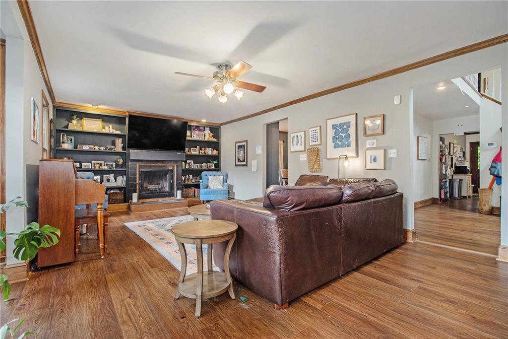 1639 Frazier Road Decatur, GA 30033 - Photo 8 of 30 a living room with furniture a flat screen tv and a fireplace