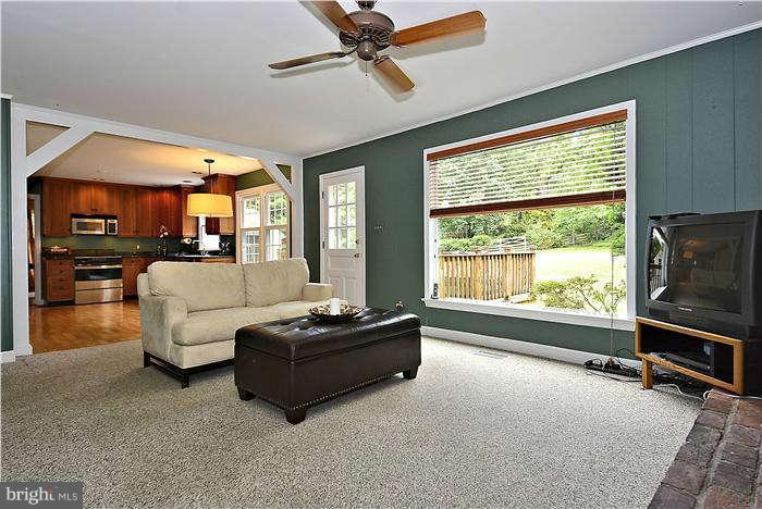 15701 Tierra Drive Silver Spring, MD 20906 - Photo 11 of 30 Family Room with large window and door to deck