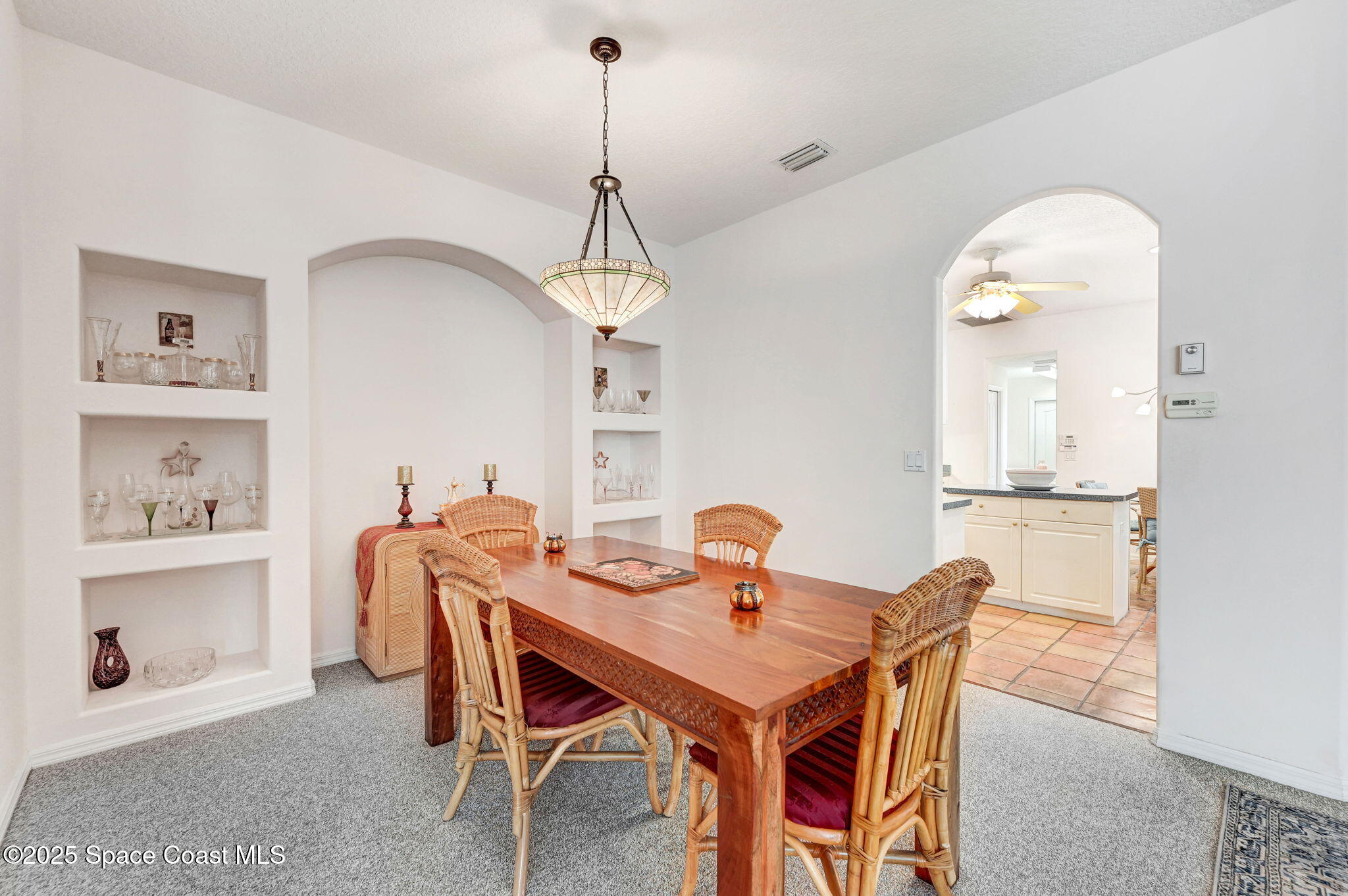 4341 Aberdeen Circle Rockledge, FL 32955 - Photo 11 of 43 a view of a dining room with a table and chairs