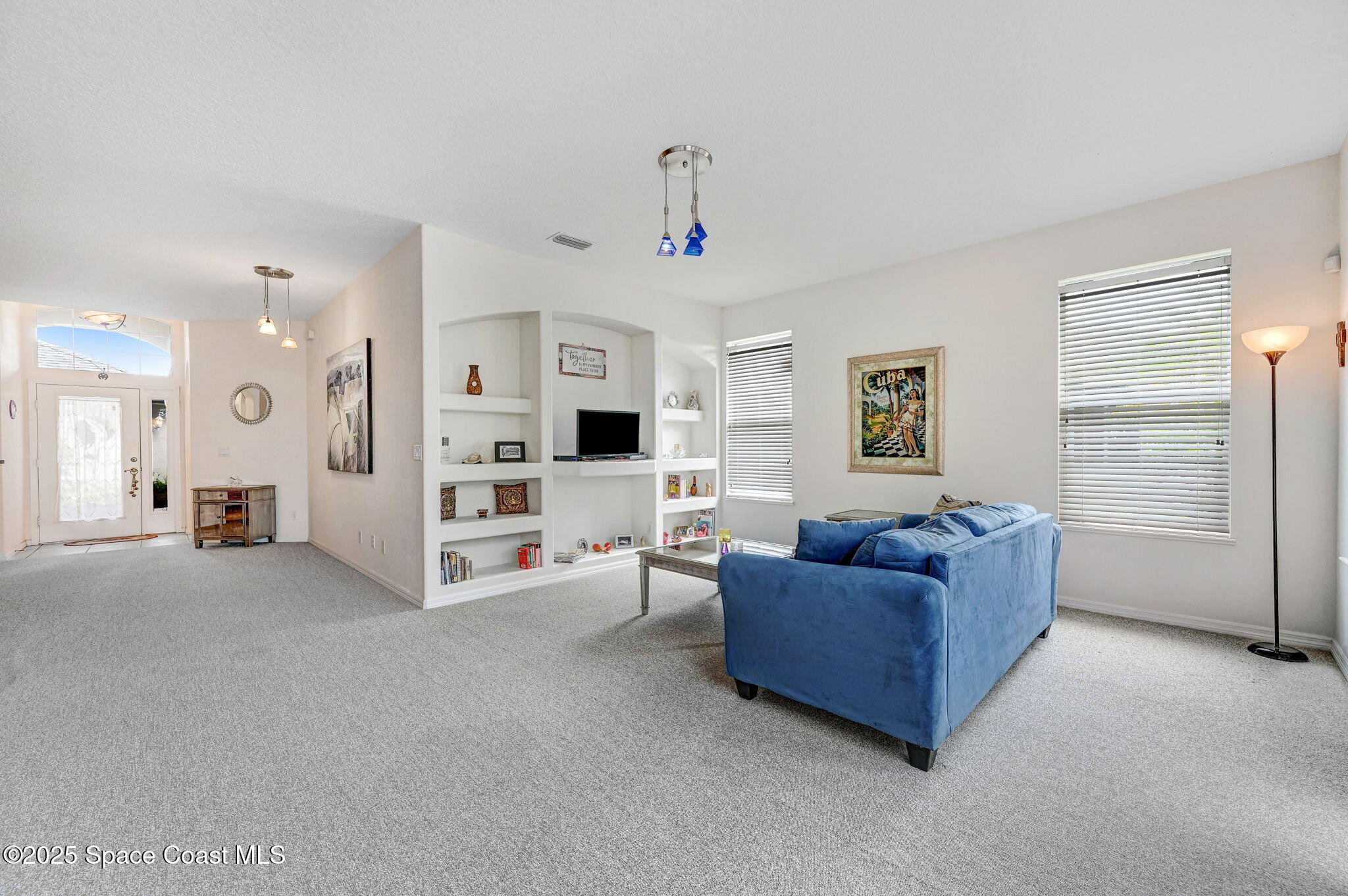 4341 Aberdeen Circle Rockledge, FL 32955 - Photo 17 of 43 a living room with furniture and a flat screen tv