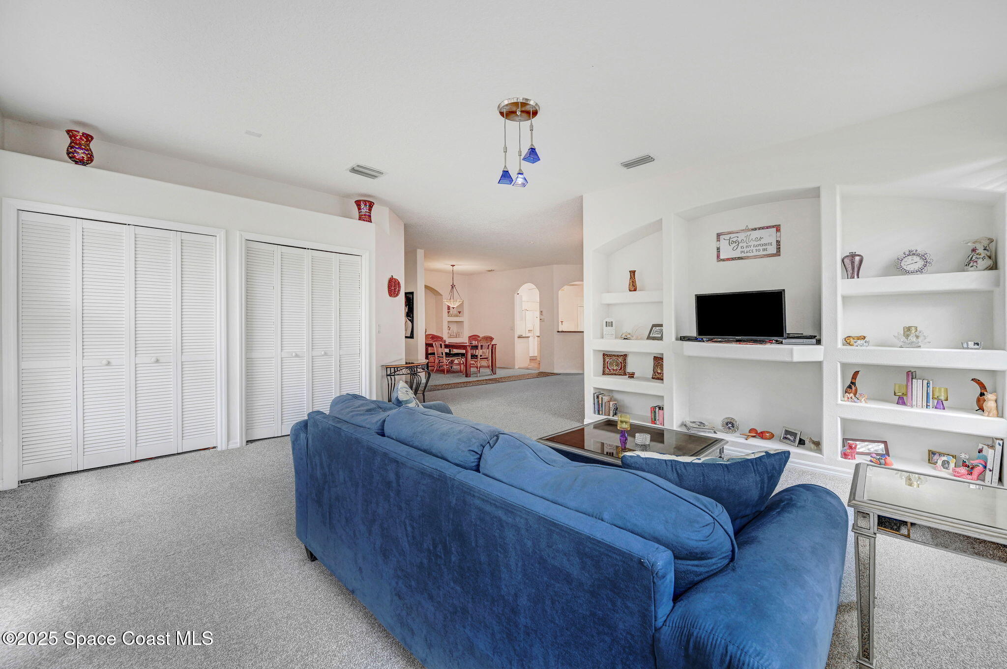 4341 Aberdeen Circle Rockledge, FL 32955 - Photo 18 of 43 a living room with furniture and a flat screen tv