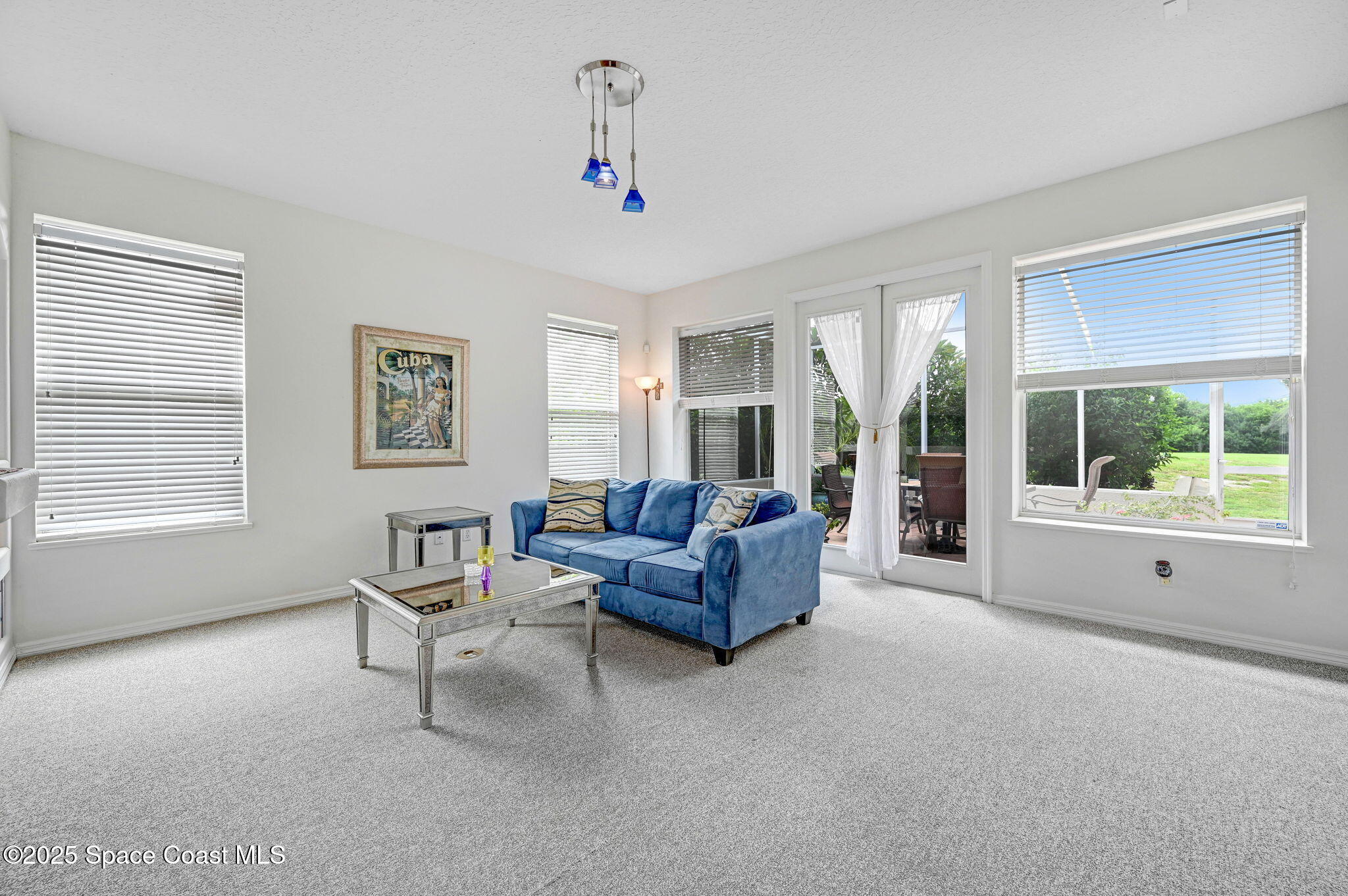 4341 Aberdeen Circle Rockledge, FL 32955 - Photo 19 of 43 a living room with furniture and a large window