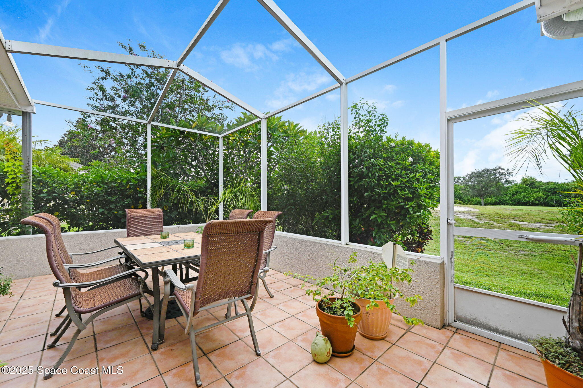 4341 Aberdeen Circle Rockledge, FL 32955 - Photo 20 of 43 a view of a chairs and table in the patio