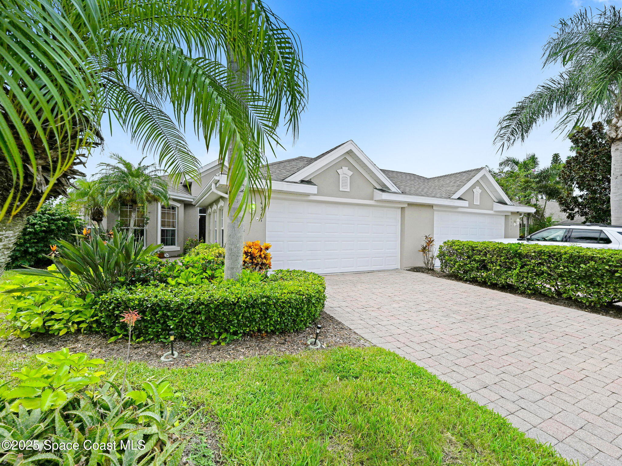 4341 Aberdeen Circle Rockledge, FL 32955 - Photo 2 of 43 a front view of a house with a garden