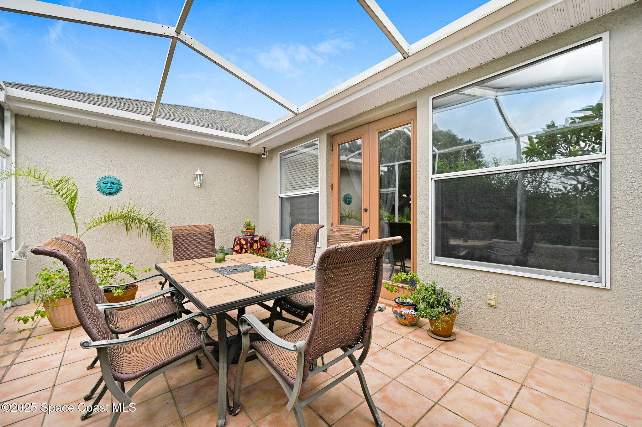 4341 Aberdeen Circle Rockledge, FL 32955 - Photo 21 of 43 a outdoor dining space with a table and chairs