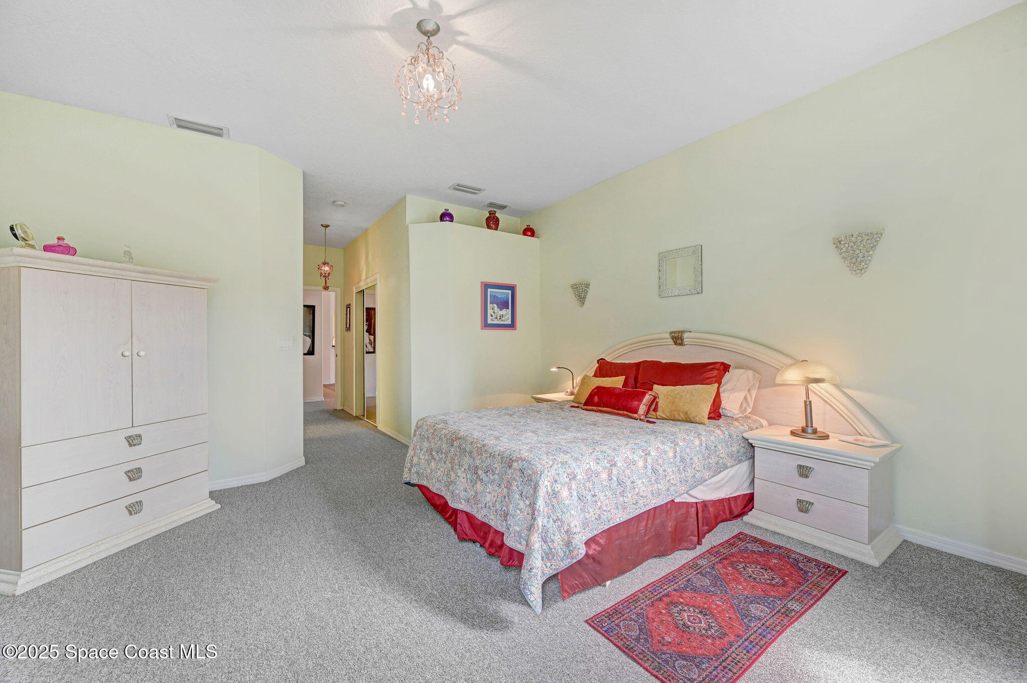 4341 Aberdeen Circle Rockledge, FL 32955 - Photo 24 of 43 a bedroom with a bed and cabinets