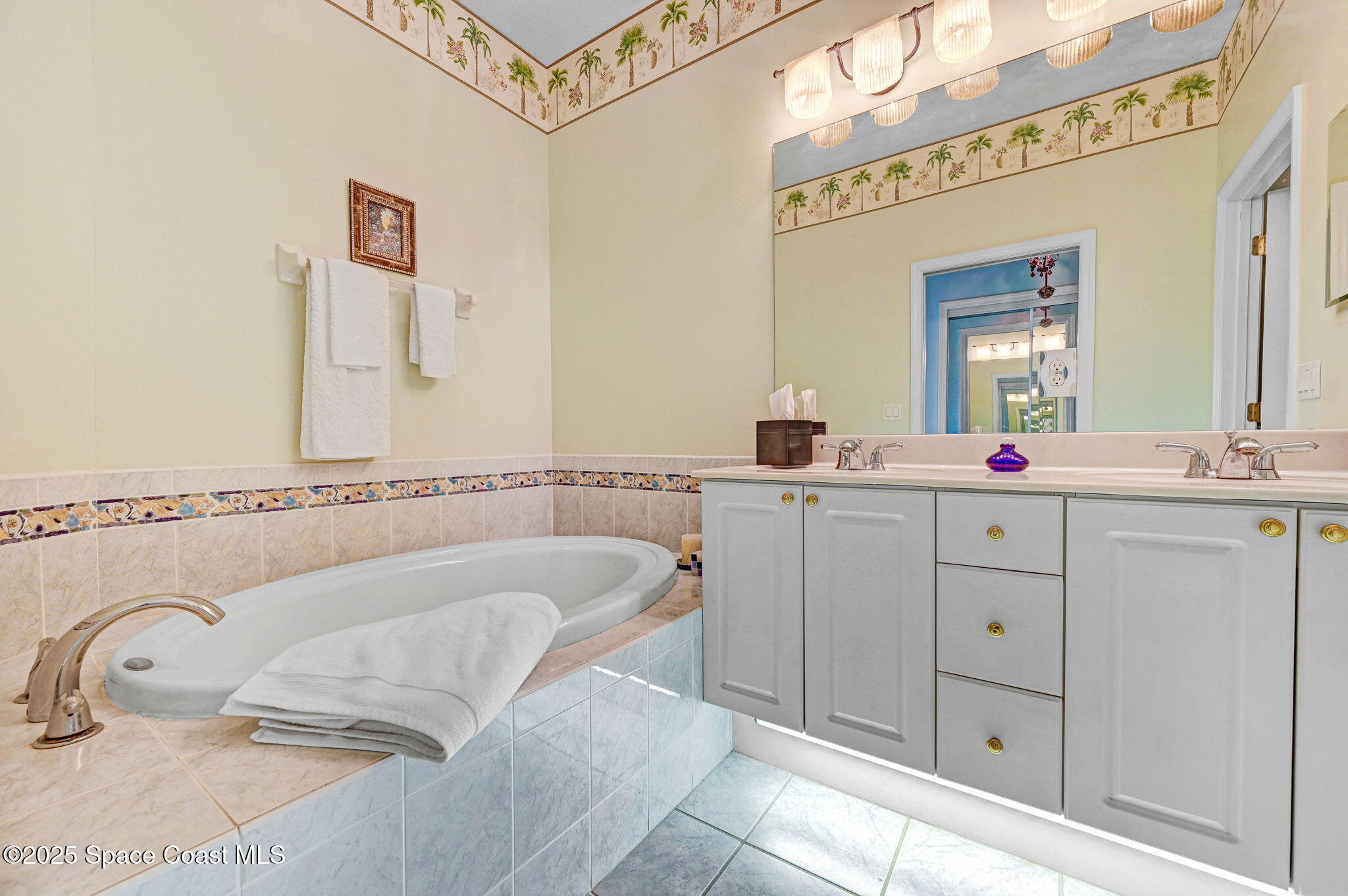 4341 Aberdeen Circle Rockledge, FL 32955 - Photo 25 of 43 a bathroom with a sink mirror and a bathtub