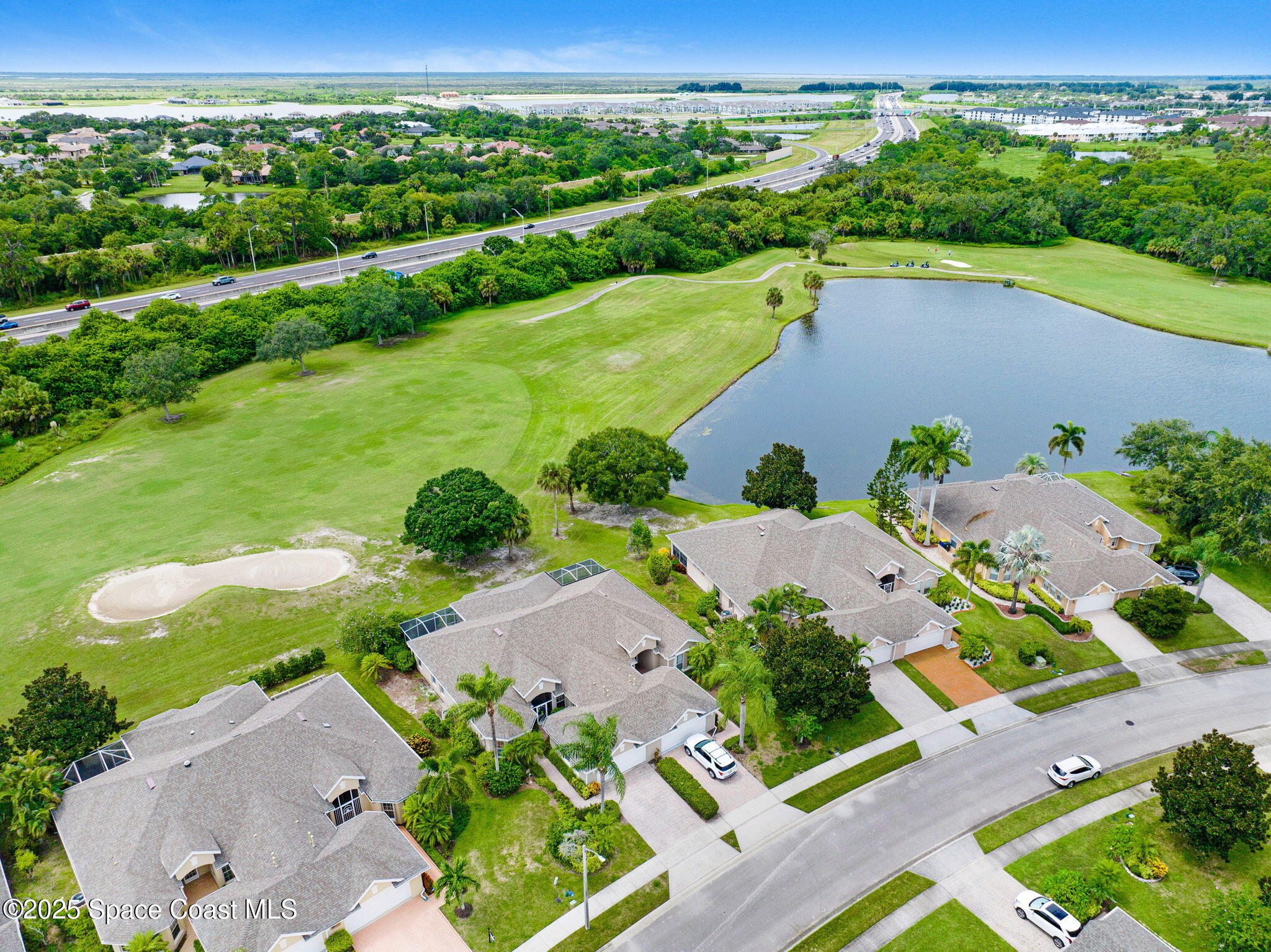 4341 Aberdeen Circle Rockledge, FL 32955 - Photo 27 of 43 an aerial view of a house with garden space lake view and mountain view in back