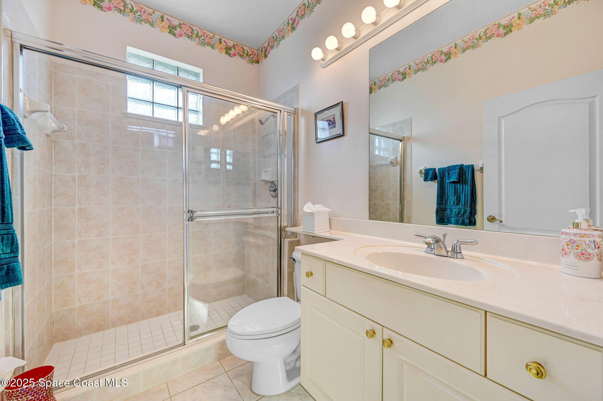 4341 Aberdeen Circle Rockledge, FL 32955 - Photo 29 of 43 a bathroom with a sink a toilet and shower