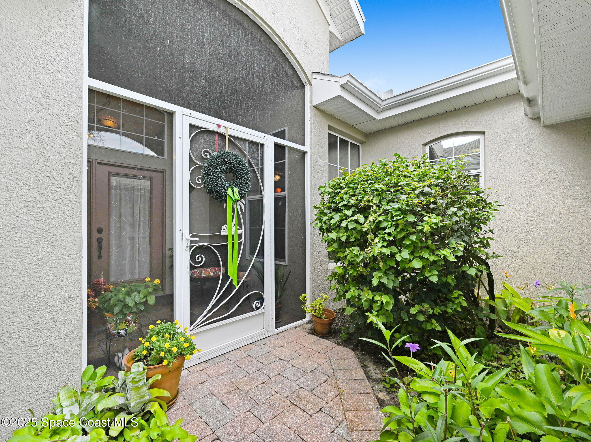 4341 Aberdeen Circle Rockledge, FL 32955 - Photo 3 of 43 a front view of a house with garden