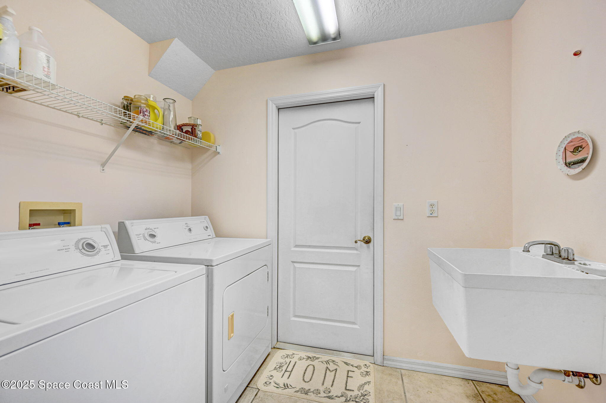 4341 Aberdeen Circle Rockledge, FL 32955 - Photo 31 of 43 a utility room with dryer and washer