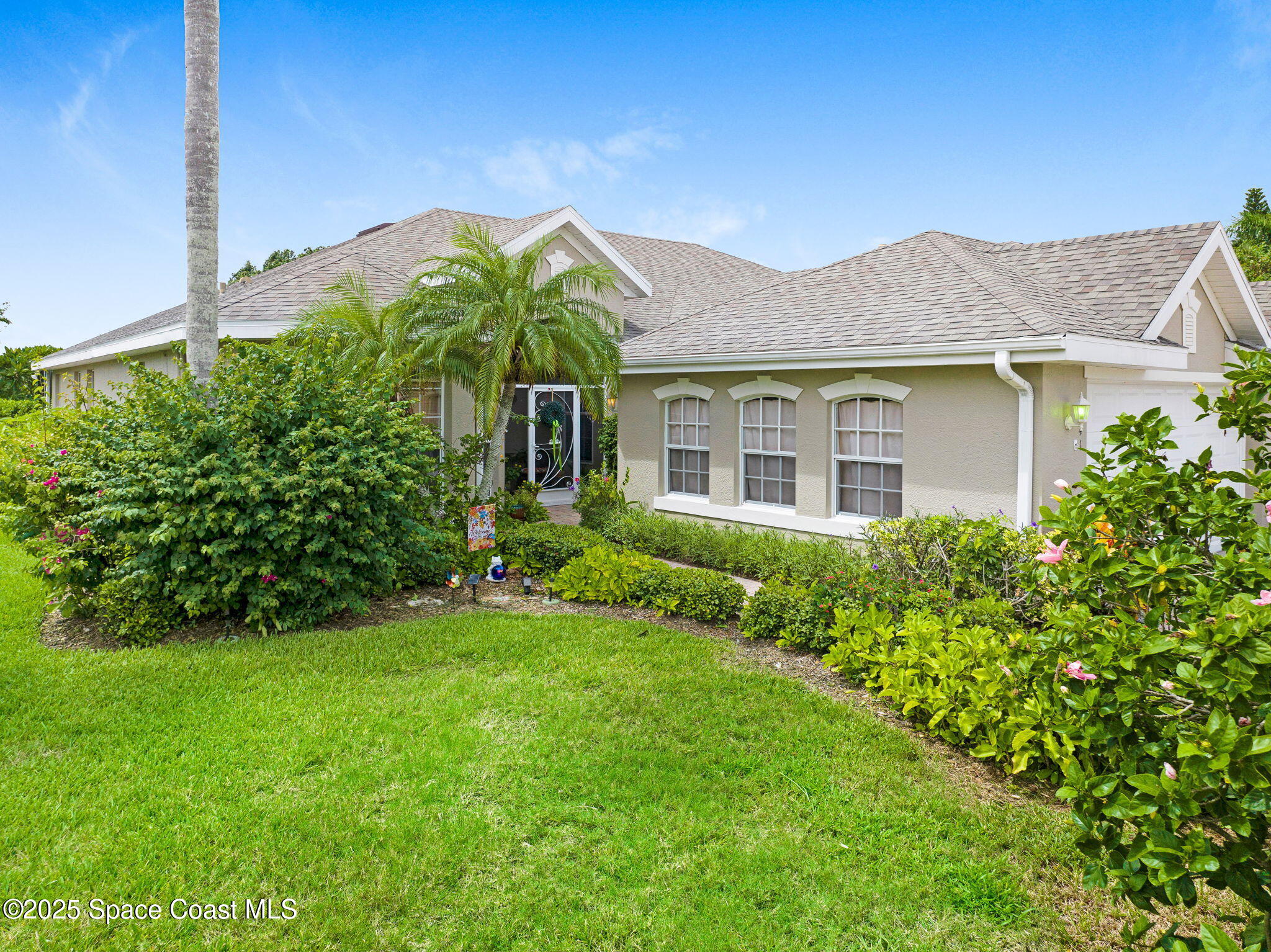 4341 Aberdeen Circle Rockledge, FL 32955 - Photo 32 of 43 a front view of a house with a garden