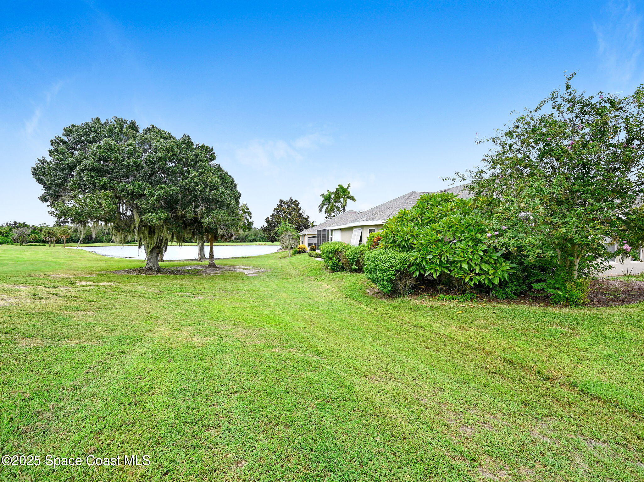4341 Aberdeen Circle Rockledge, FL 32955 - Photo 33 of 43 a view of green field with trees in the background