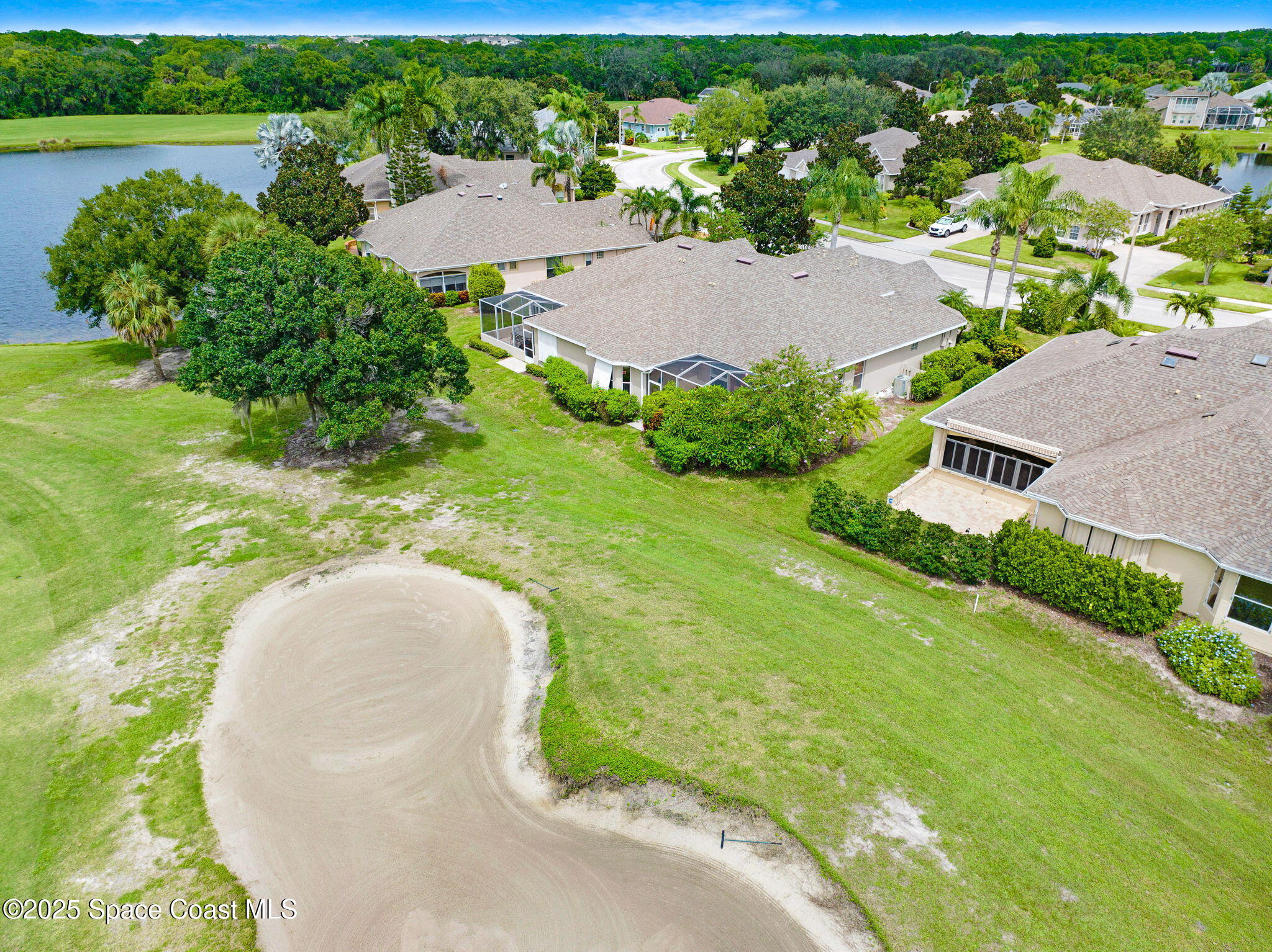 4341 Aberdeen Circle Rockledge, FL 32955 - Photo 36 of 43 an aerial view of a house with a garden and lake view