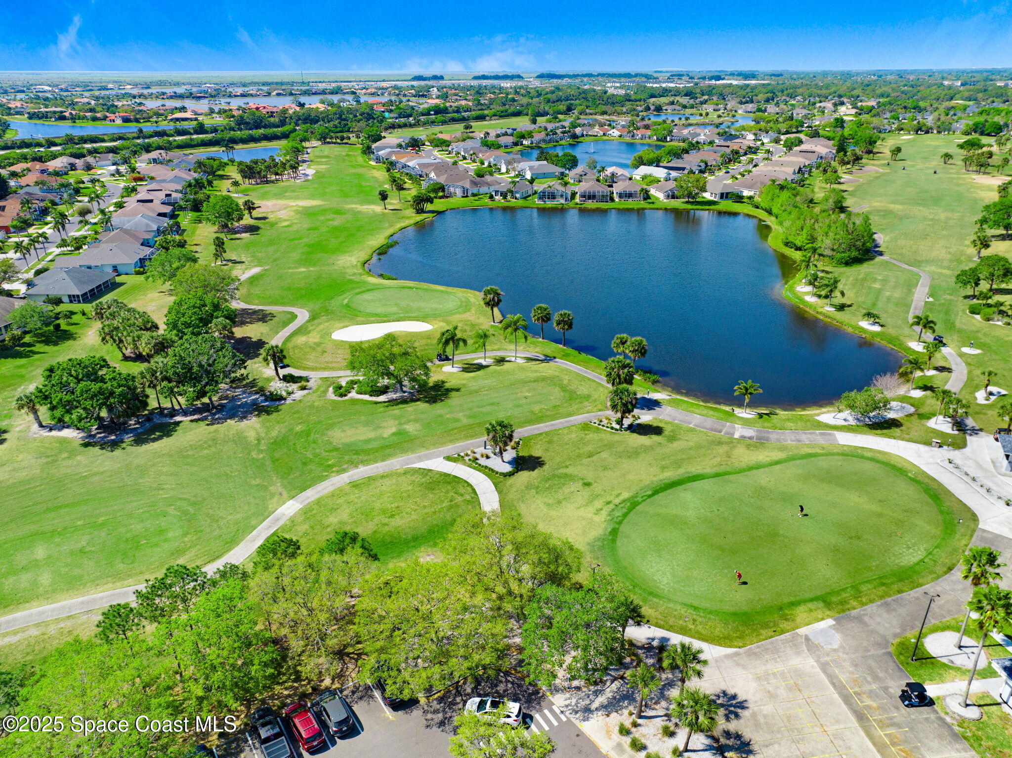 4341 Aberdeen Circle Rockledge, FL 32955 - Photo 40 of 43 a view of a garden with a lake