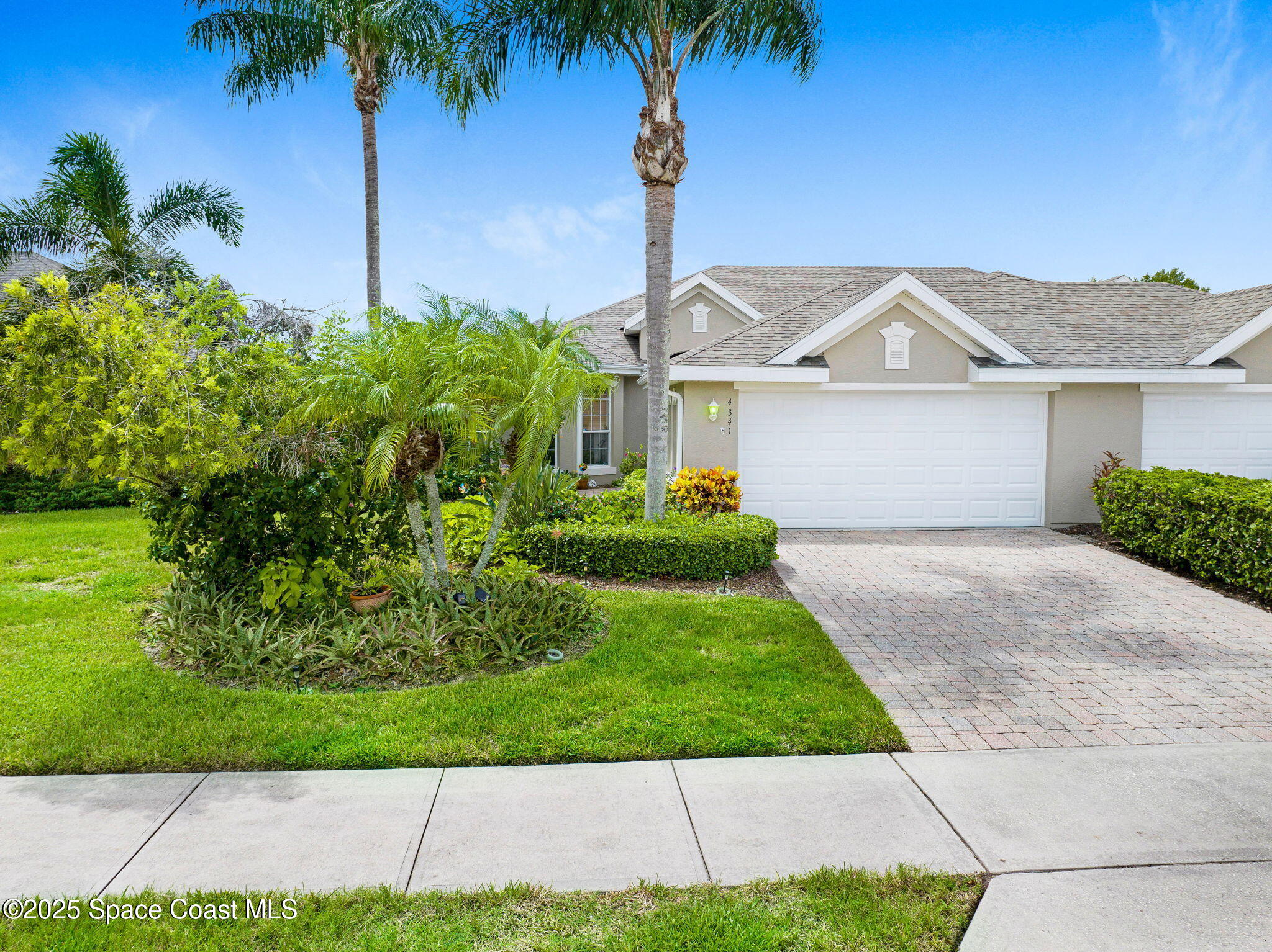 4341 Aberdeen Circle Rockledge, FL 32955 - Photo 42 of 43 a front view of a house with a garden