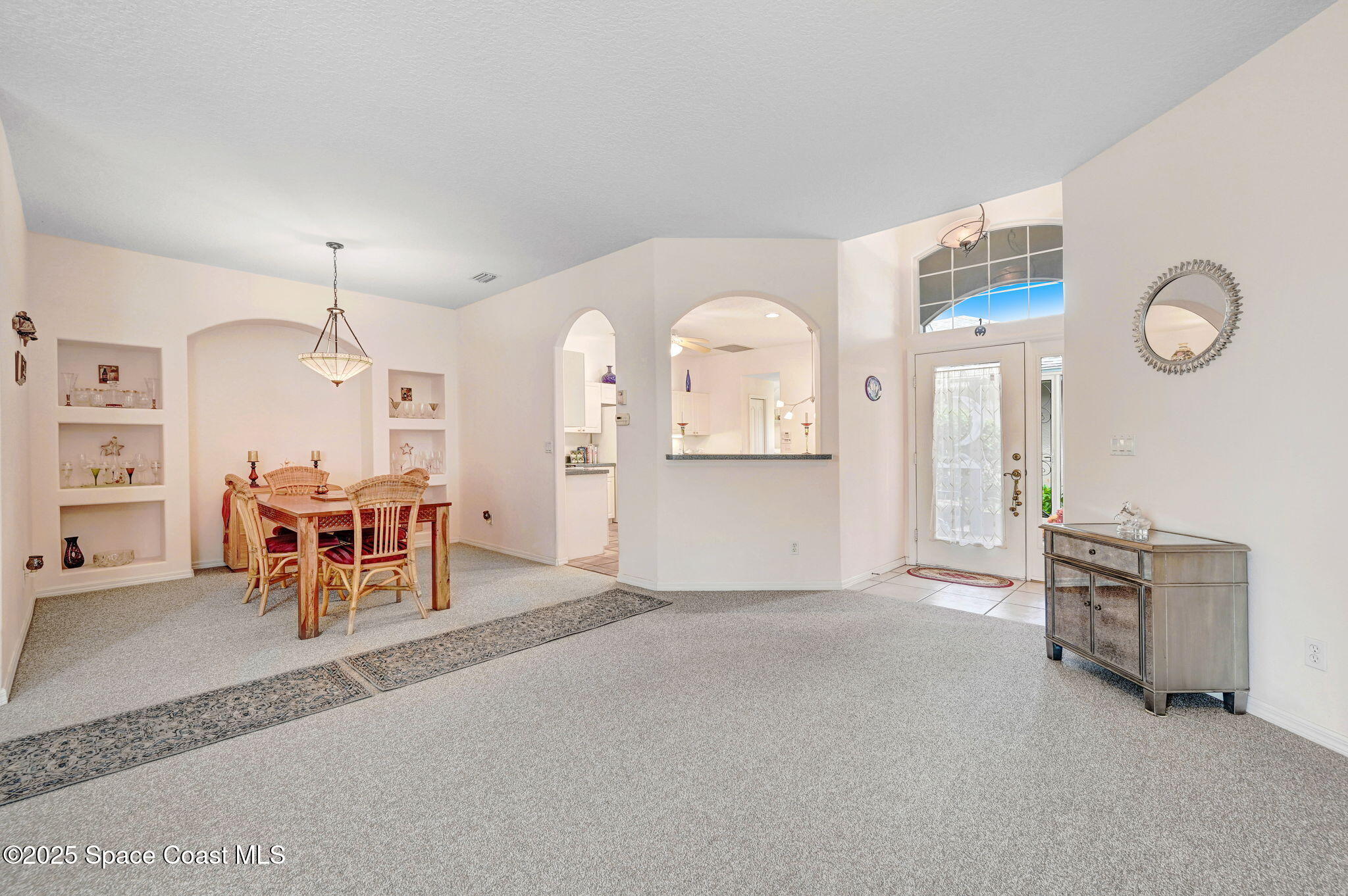 4341 Aberdeen Circle Rockledge, FL 32955 - Photo 10 of 43 a living room with furniture a table and chairs