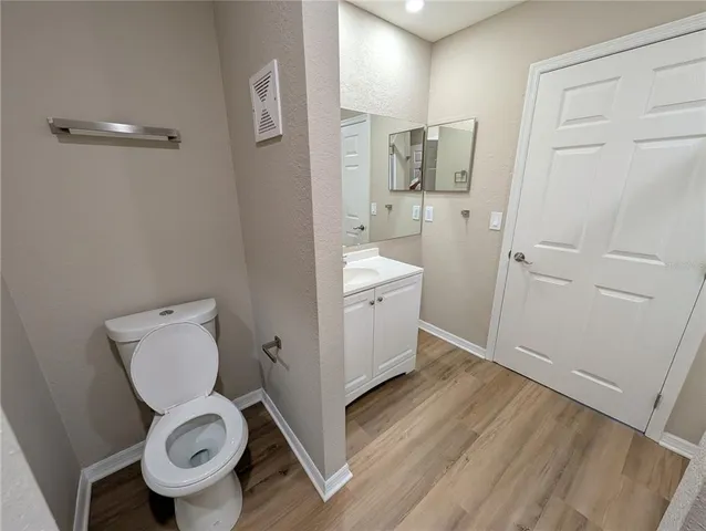 a bathroom with a toilet sink and shower