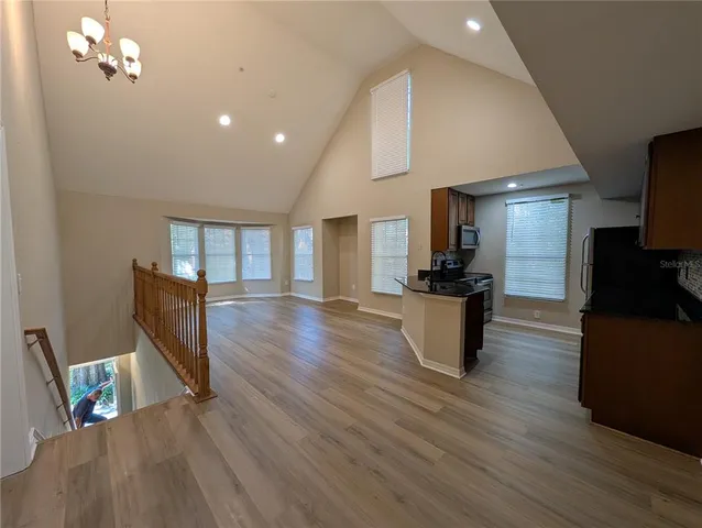 a view of kitchen with furniture and wooden floor