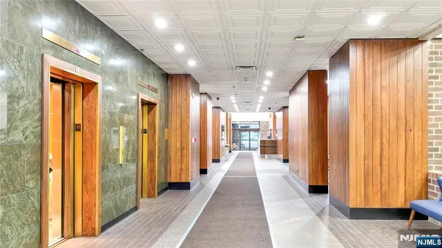 a view of a hallway with a chandelier