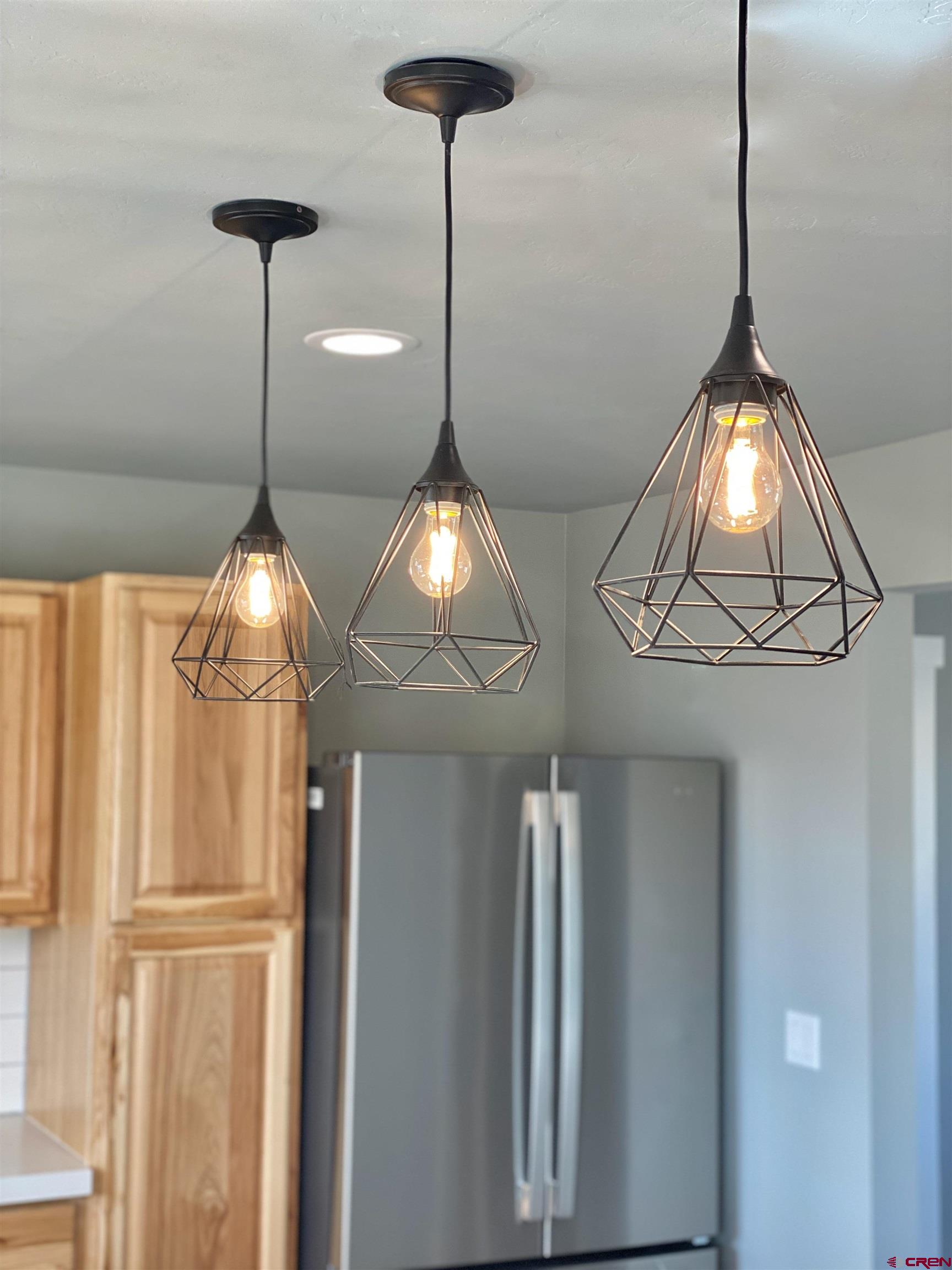 66462 Landfill Road Montrose, CO 81401 - Photo 12 of 30 a room with a chandelier fan and a window