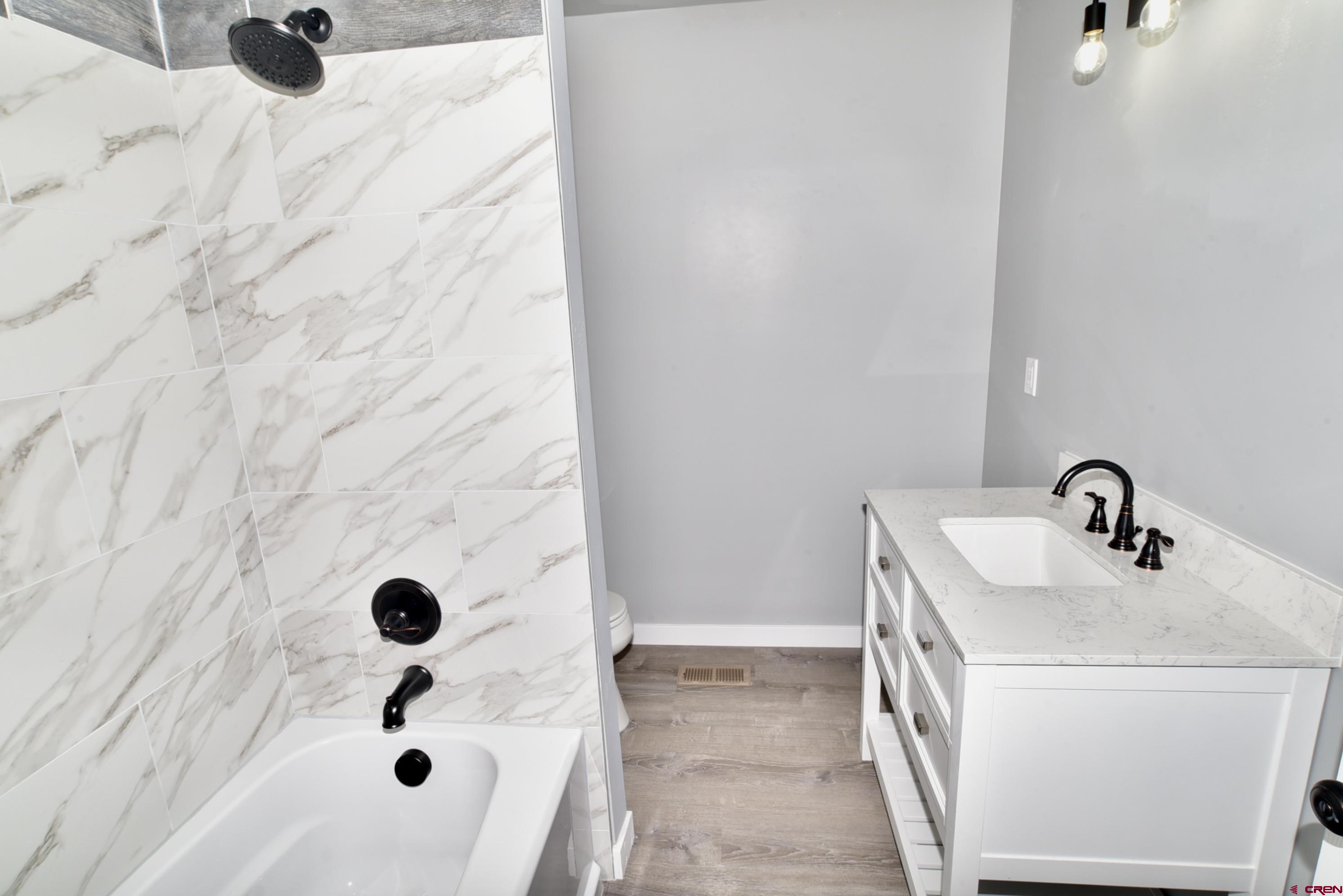 66462 Landfill Road Montrose, CO 81401 - Photo 21 of 30 a bathroom with a sink and a mirror