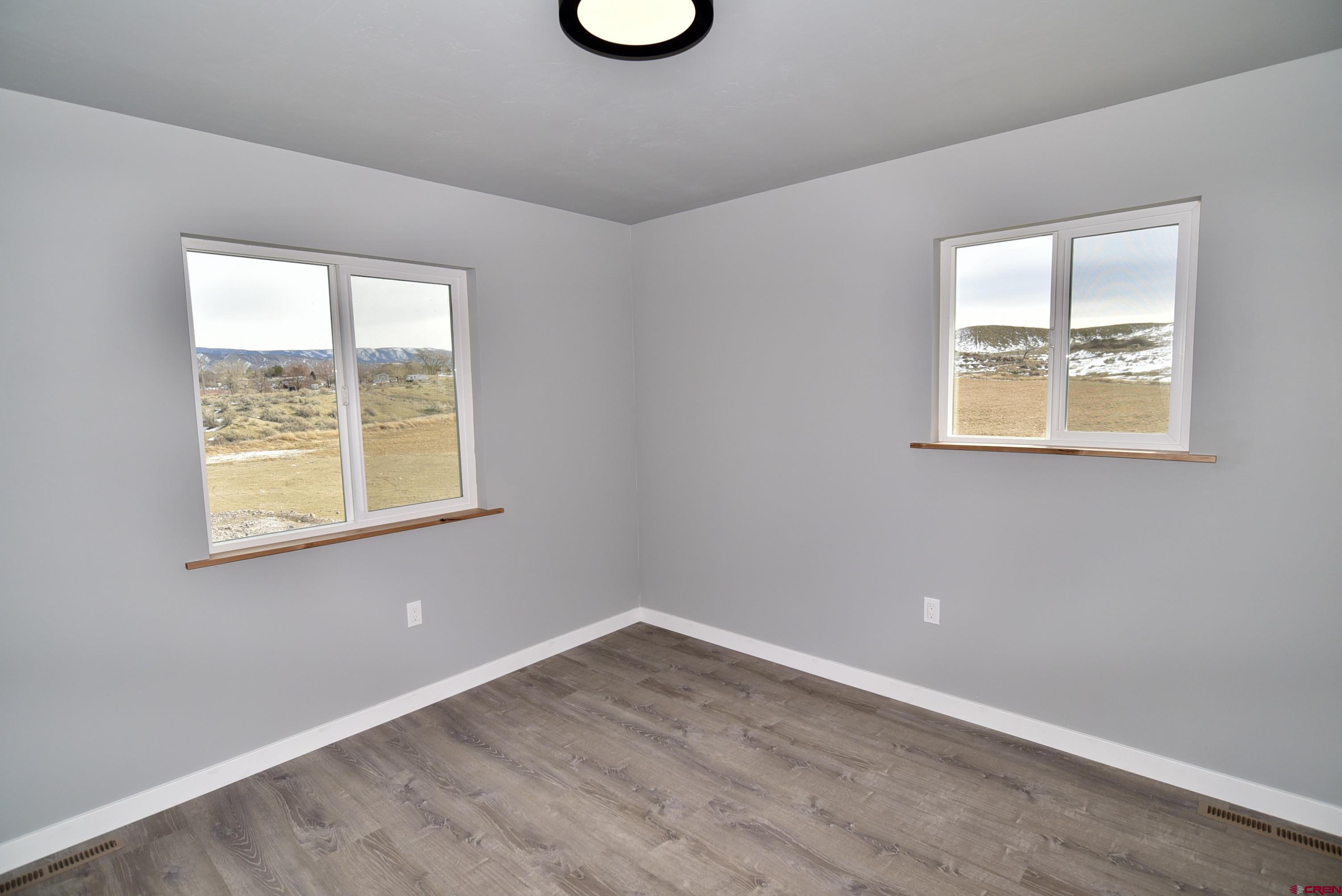 66462 Landfill Road Montrose, CO 81401 - Photo 25 of 30 an empty room with a window