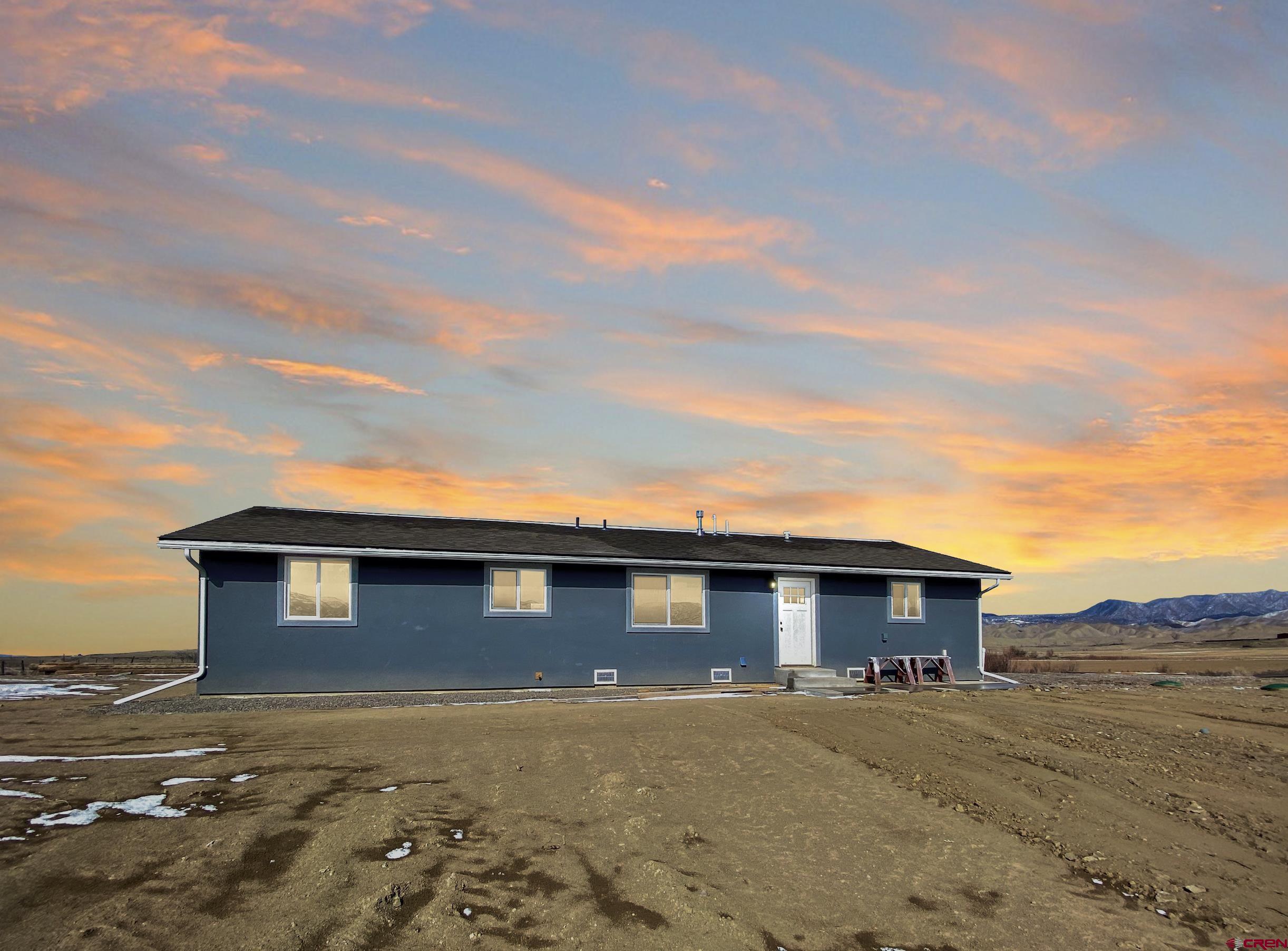 66462 Landfill Road Montrose, CO 81401 - Photo 30 of 30 a front view of a house with a yard