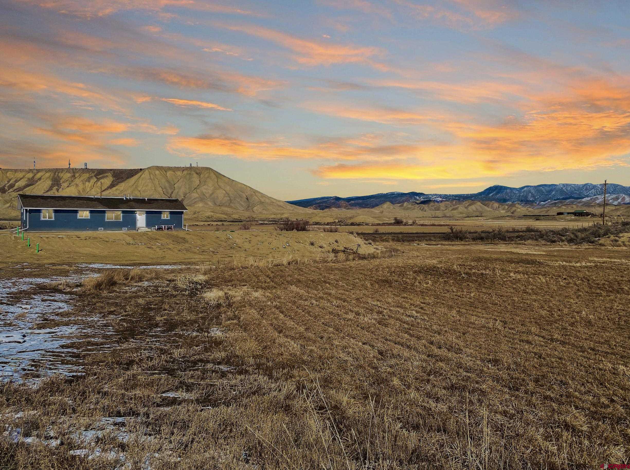 66462 Landfill Road Montrose, CO 81401 - Photo 3 of 30 a view of an ocean with a mountain