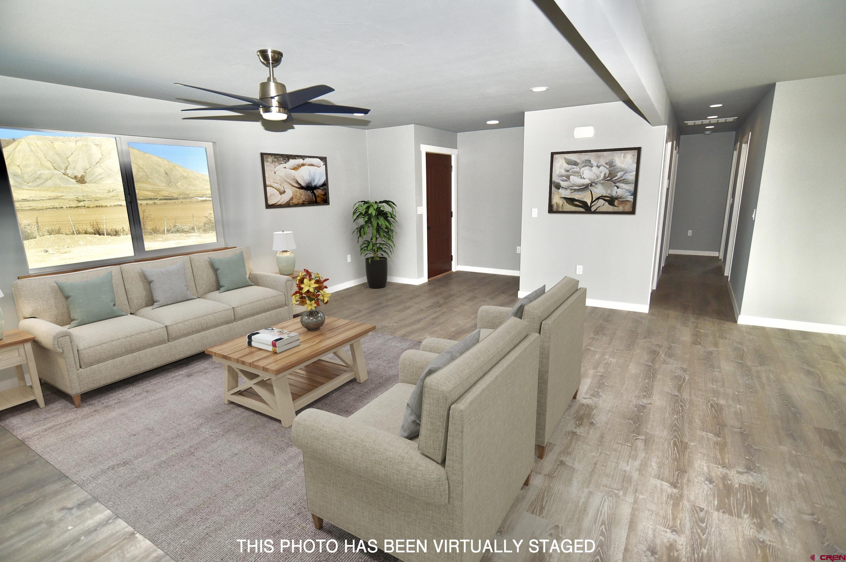 66462 Landfill Road Montrose, CO 81401 - Photo 6 of 30 a living room with furniture and window