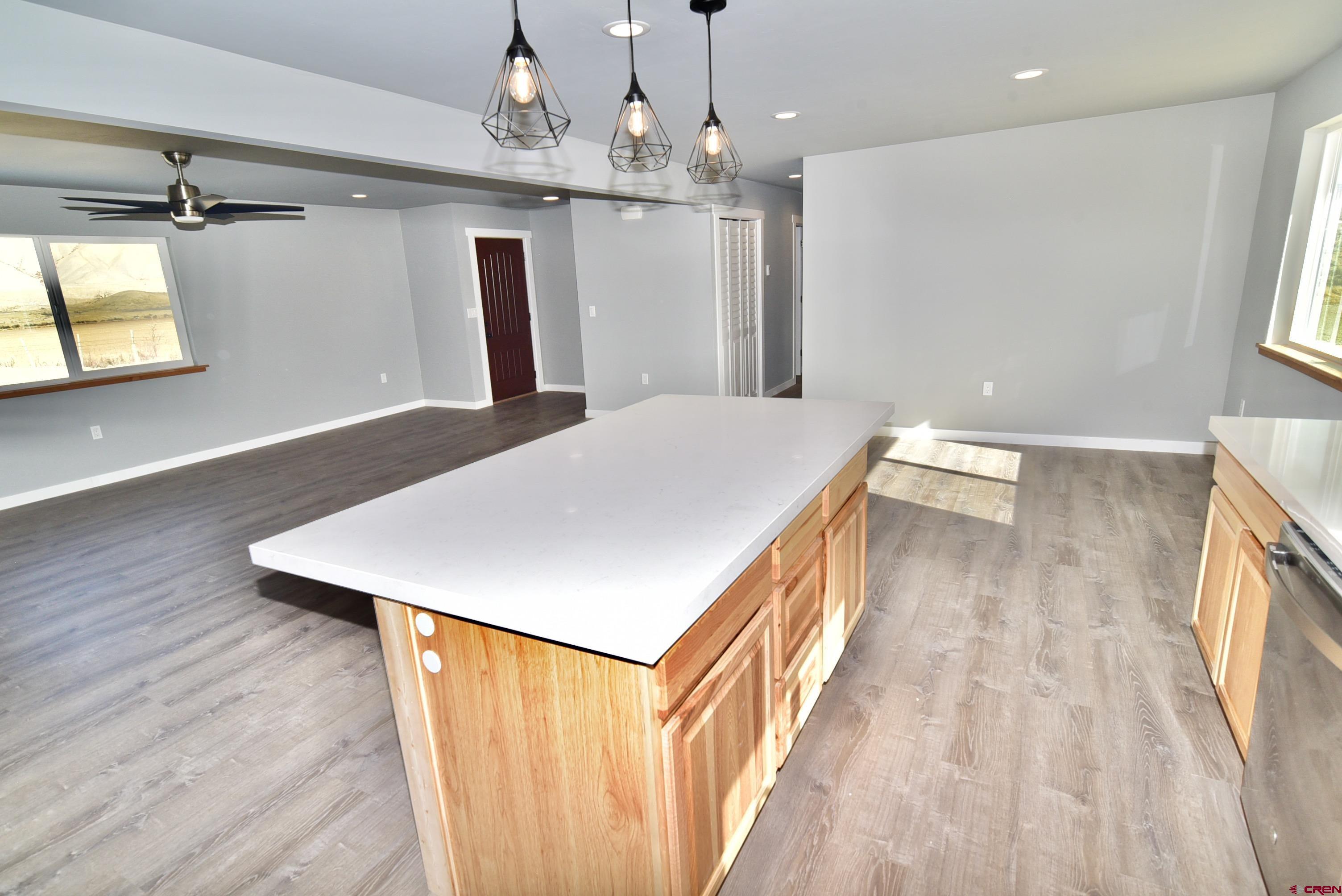 66462 Landfill Road Montrose, CO 81401 - Photo 10 of 30 a hallway with a wooden floor