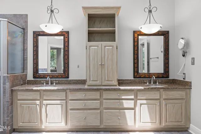 a view of a patio with table and chairs and potted plants