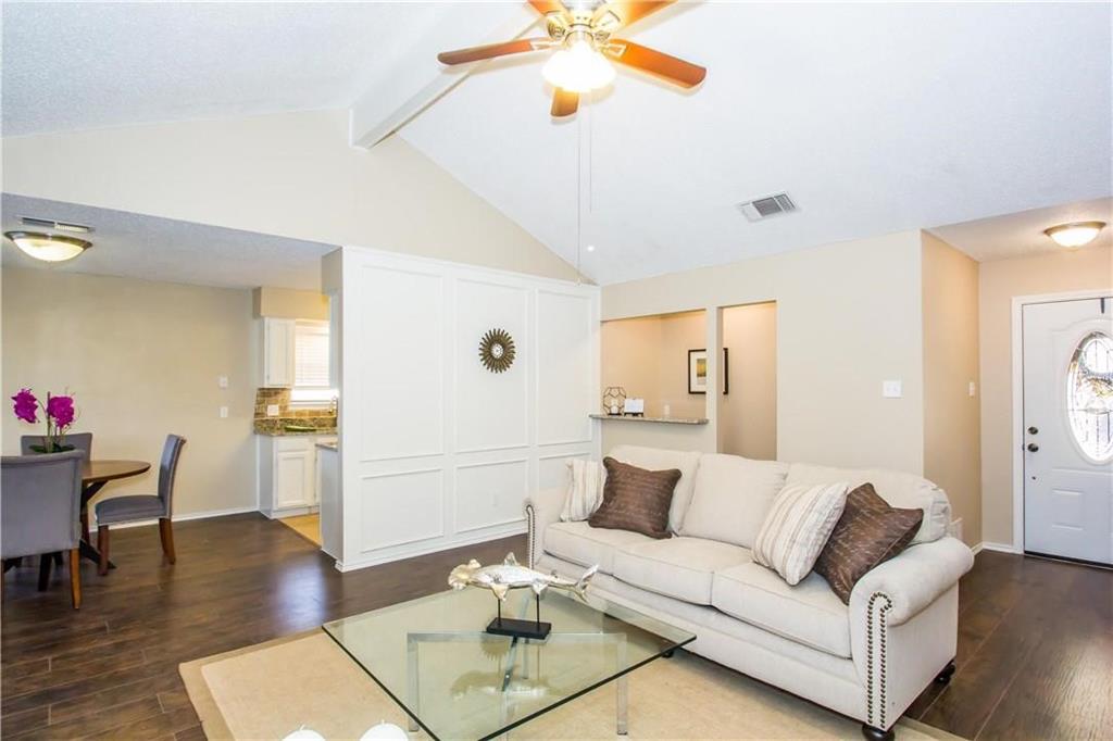 2405 Cranberry Lane Euless, TX 76039 - Photo 2 of 19 Living room with dark wood-type flooring and ceiling fan