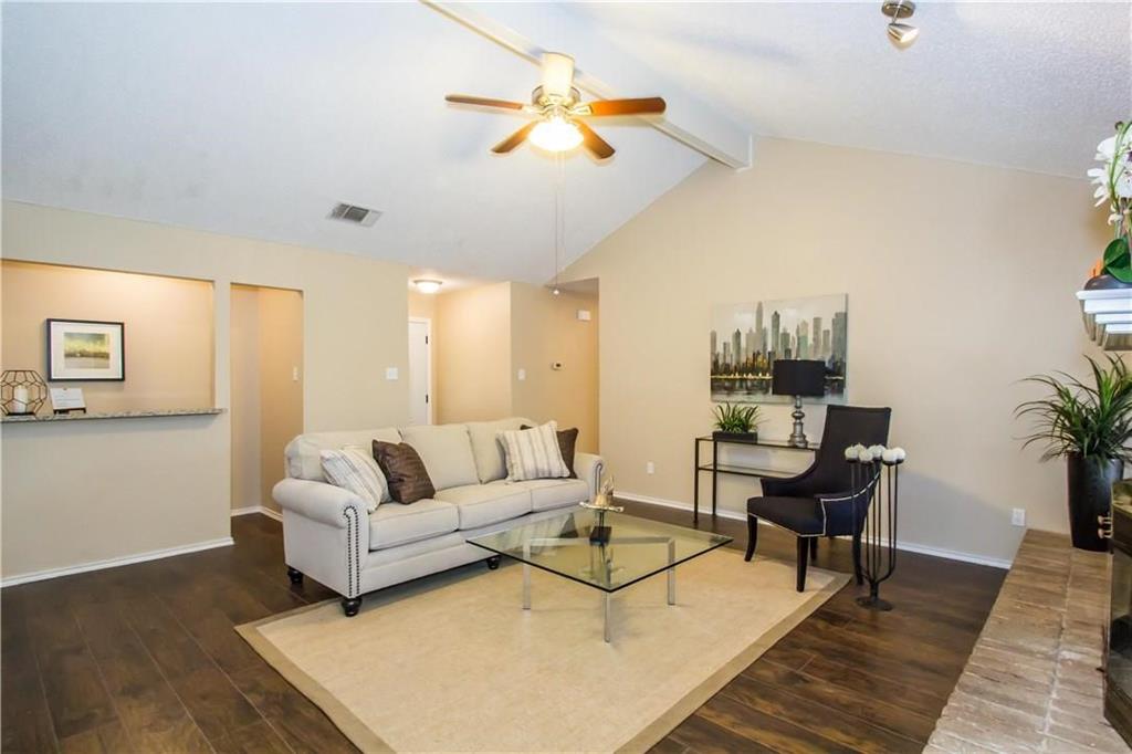 2405 Cranberry Lane Euless, TX 76039 - Photo 5 of 19 Living room featuring dark wood-style flooring and a ceiling fan