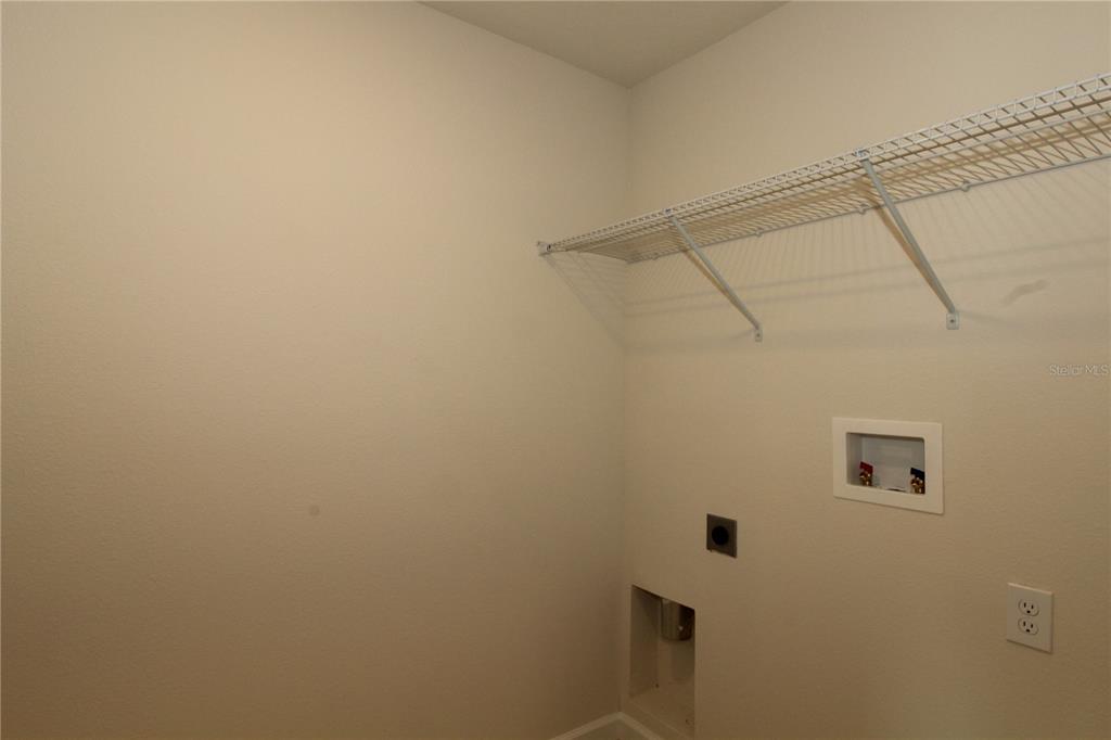 2233 Litchfield Loop DeLand, FL 32720 - Photo 16 of 20 a view of a rack on the wall