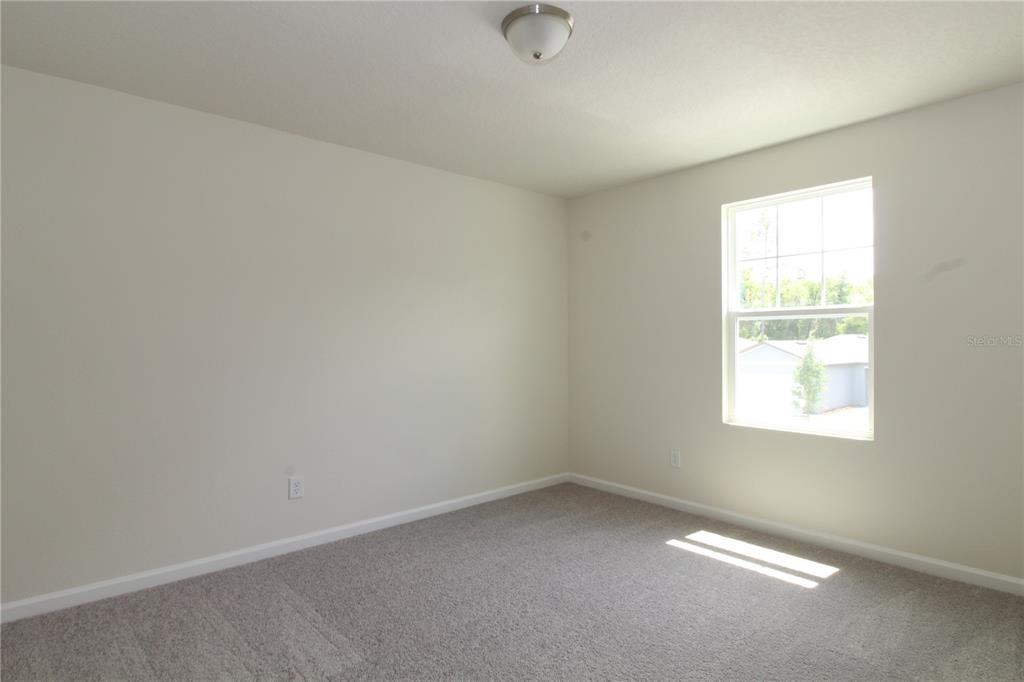 2233 Litchfield Loop DeLand, FL 32720 - Photo 19 of 20 an empty room with a window