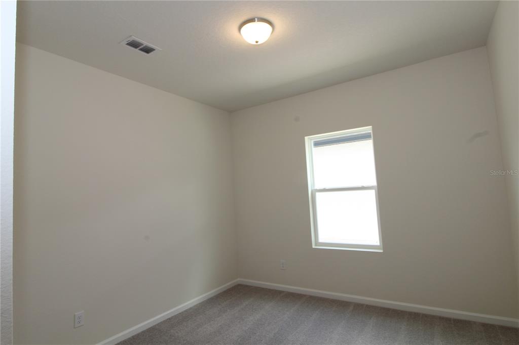 2233 Litchfield Loop DeLand, FL 32720 - Photo 8 of 20 an empty room with a window