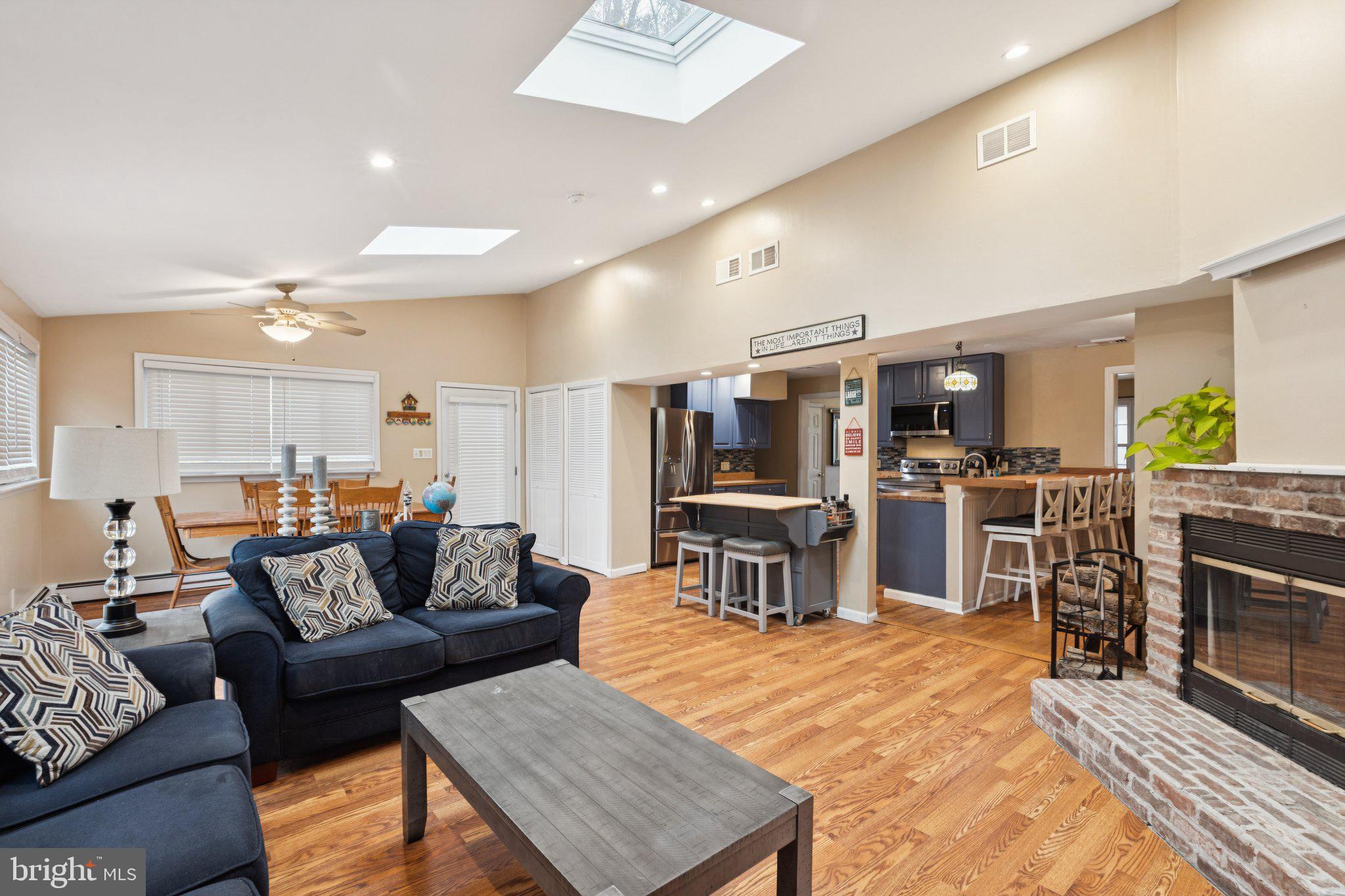 35 Buckwalter Road Eagleville, PA 19403 - Photo 14 of 54 a living room with lots of furniture and kitchen view