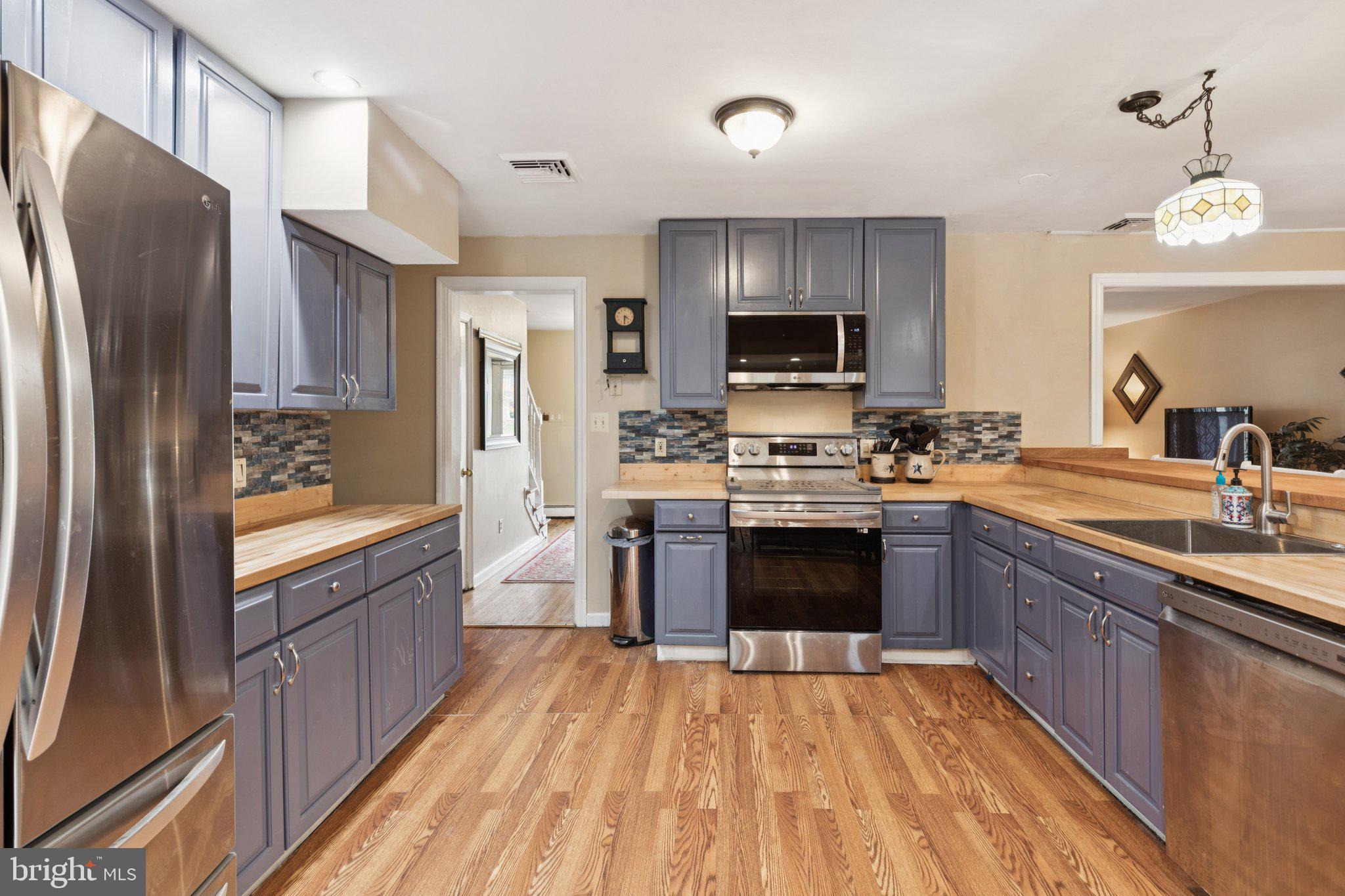 35 Buckwalter Road Eagleville, PA 19403 - Photo 19 of 54 a large kitchen with granite countertop a refrigerator stove top oven and sink