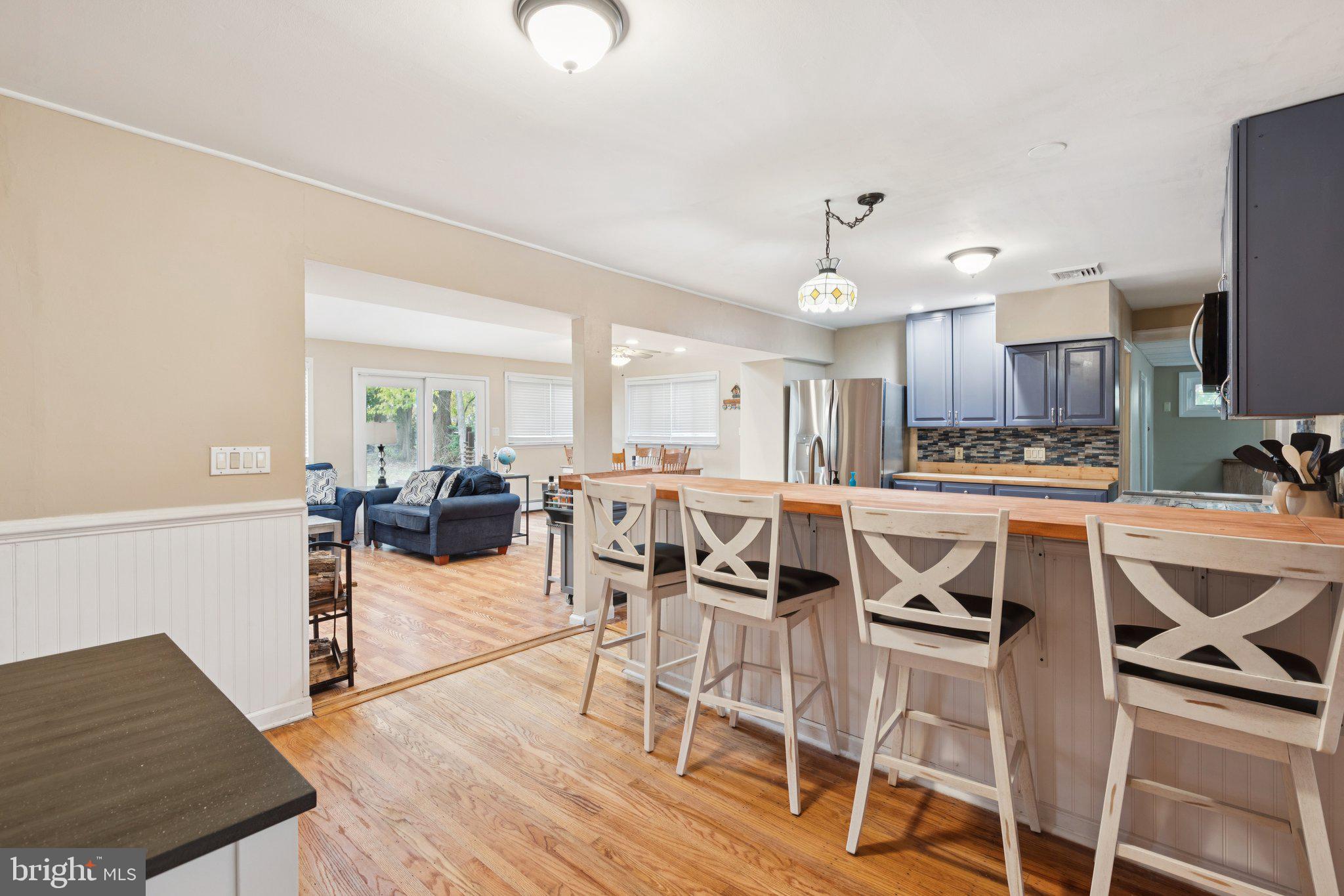 35 Buckwalter Road Eagleville, PA 19403 - Photo 24 of 54 a kitchen with stainless steel appliances kitchen island granite countertop a table chairs sink and cabinets