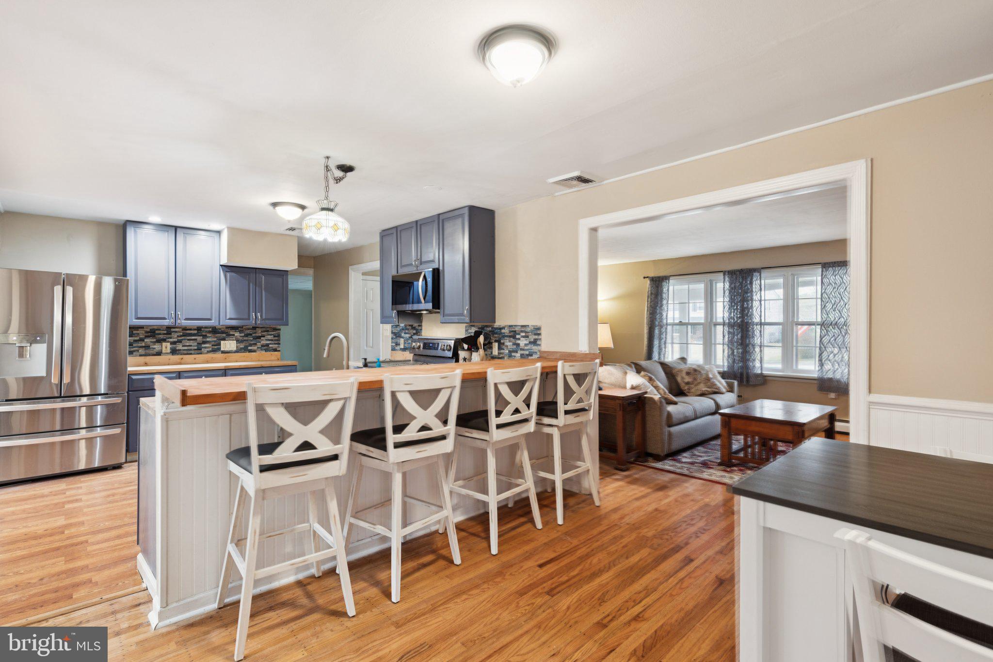 35 Buckwalter Road Eagleville, PA 19403 - Photo 25 of 54 a dining hall with stainless steel appliances kitchen island granite countertop a dining table chairs and view living room