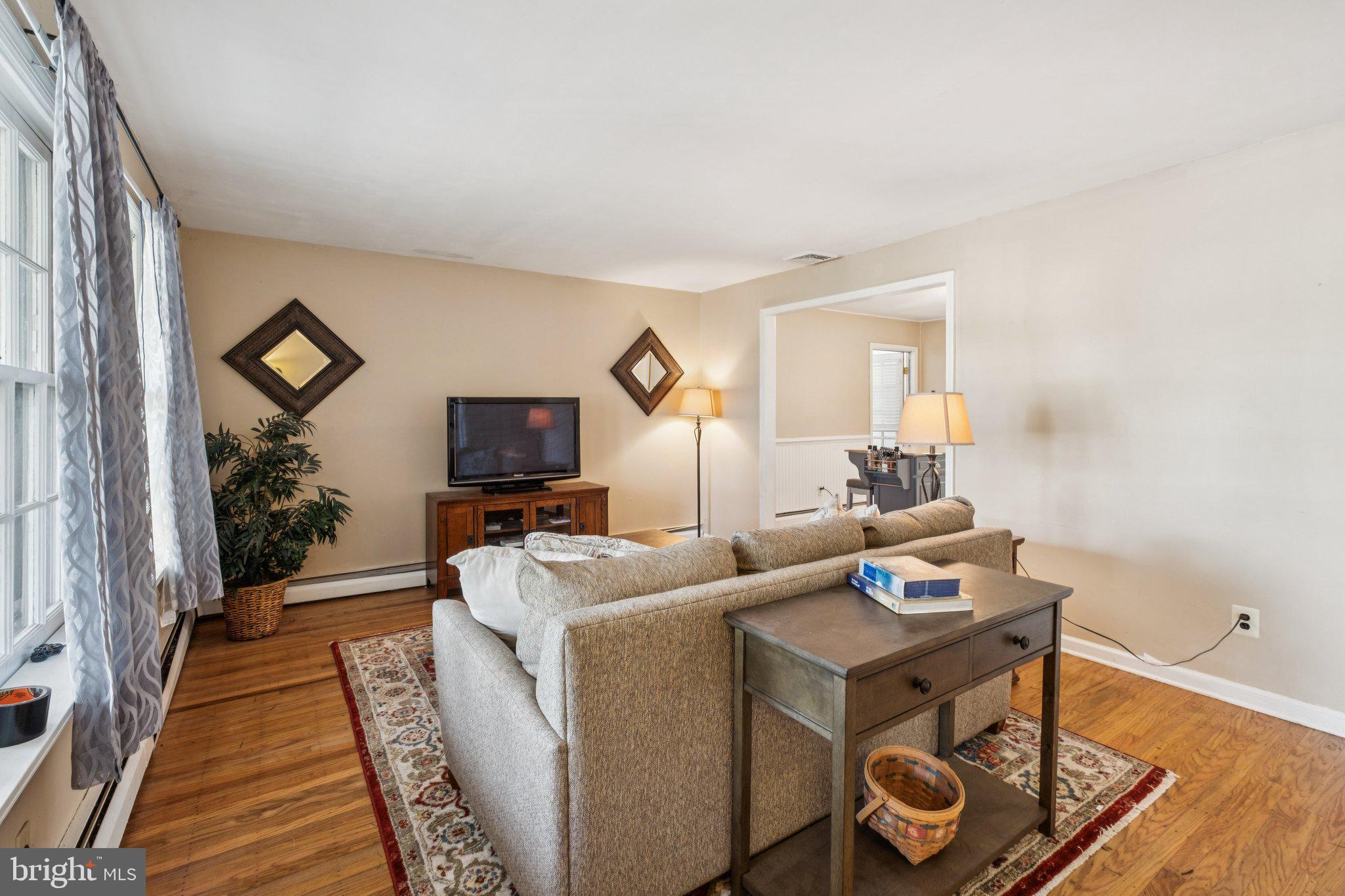35 Buckwalter Road Eagleville, PA 19403 - Photo 32 of 54 a living room with furniture and a flat screen tv