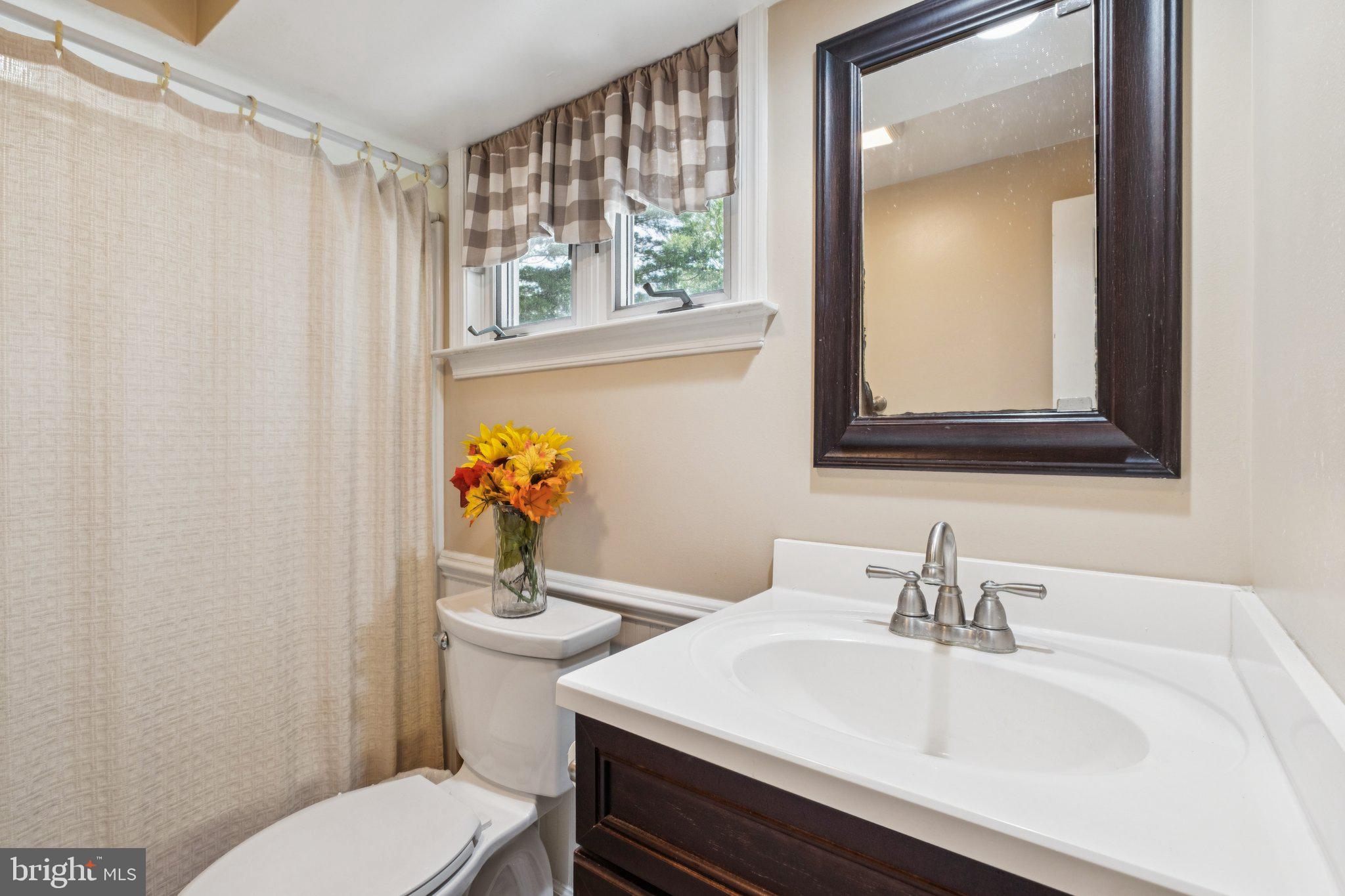 35 Buckwalter Road Eagleville, PA 19403 - Photo 37 of 54 a bathroom with a sink toilet and mirror