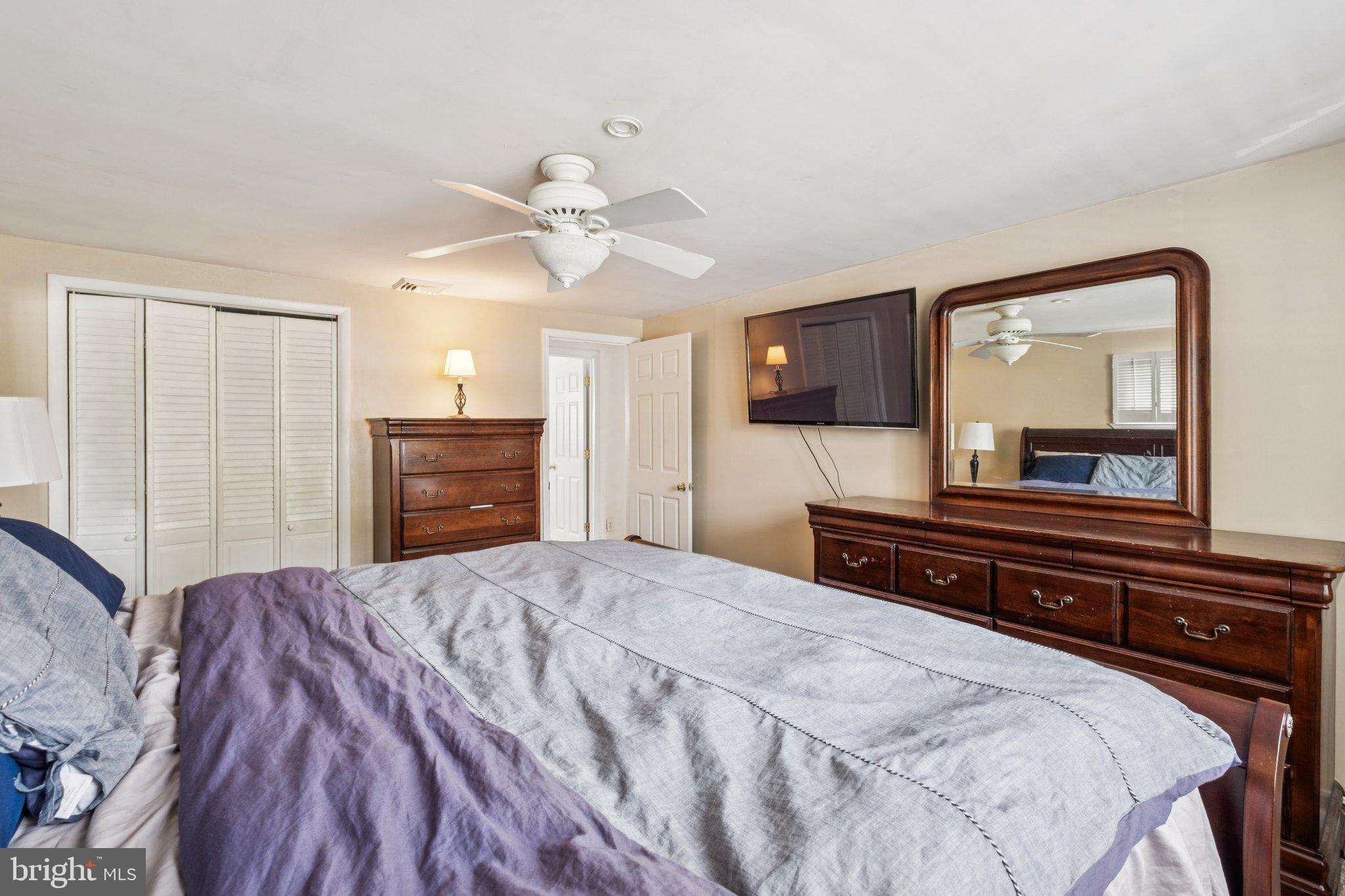 35 Buckwalter Road Eagleville, PA 19403 - Photo 39 of 54 a bedroom with a bed and a mirror on dresser