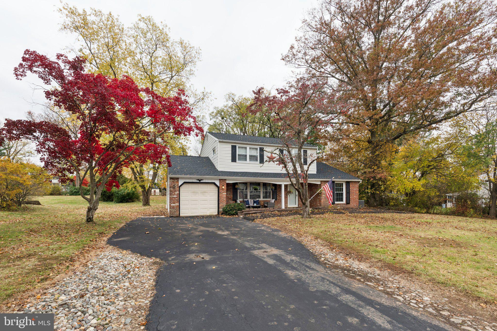 35 Buckwalter Road Eagleville, PA 19403 - Photo 6 of 54 a front view of a house with a yard and trees