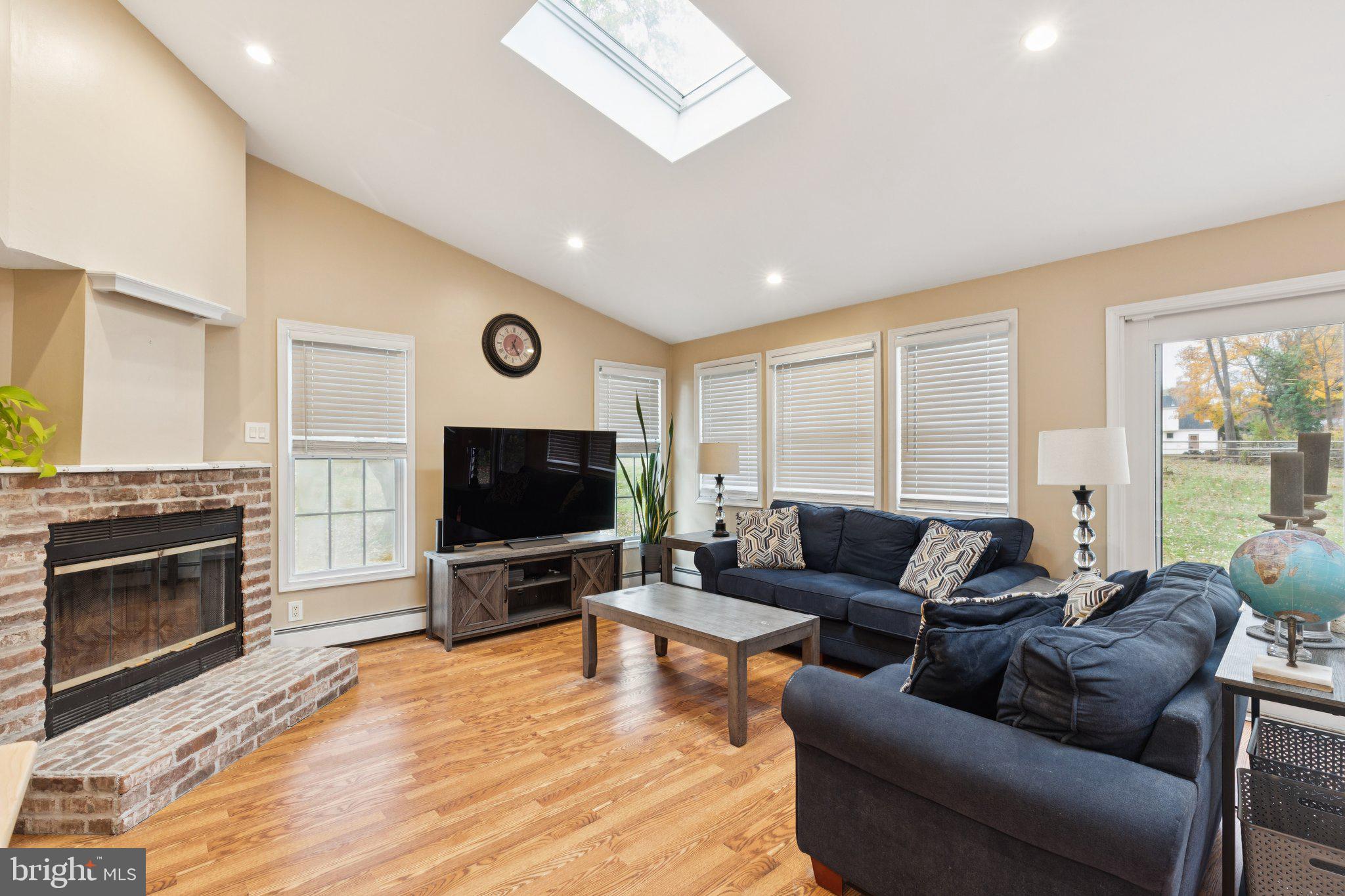35 Buckwalter Road Eagleville, PA 19403 - Photo 9 of 54 a living room with furniture and a flat screen tv