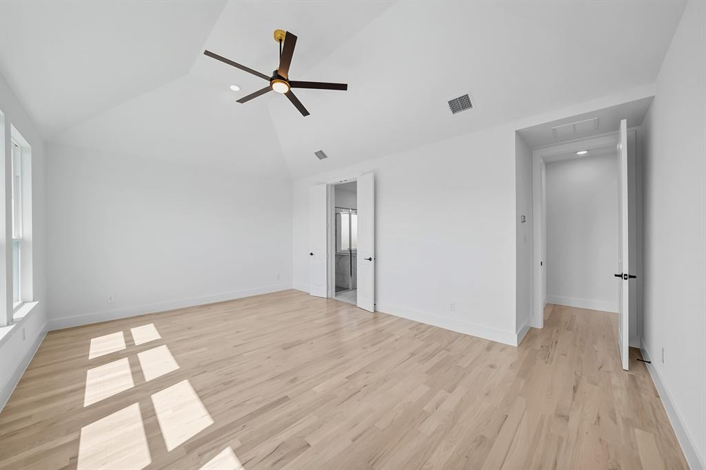 587 Mayfair Lane Frisco, TX 75033 - Photo 19 of 37 a view of a room with wooden floor and a ceiling fan