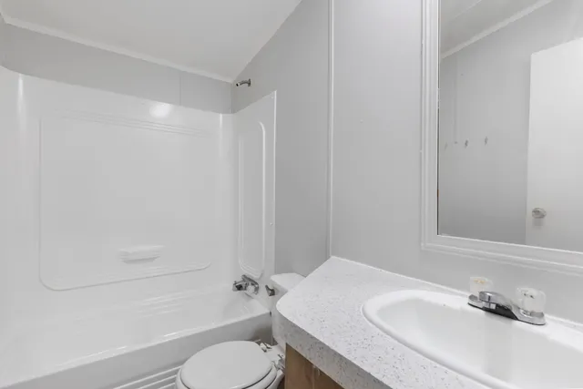 a view of a backyard with pathway