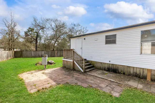 a view of a backyard of the house